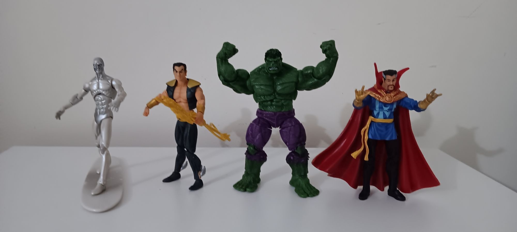 Four Marvel action figures placed side by side.

From left to right: Silver Surfer, Namor, Hulk, Doctor Strange