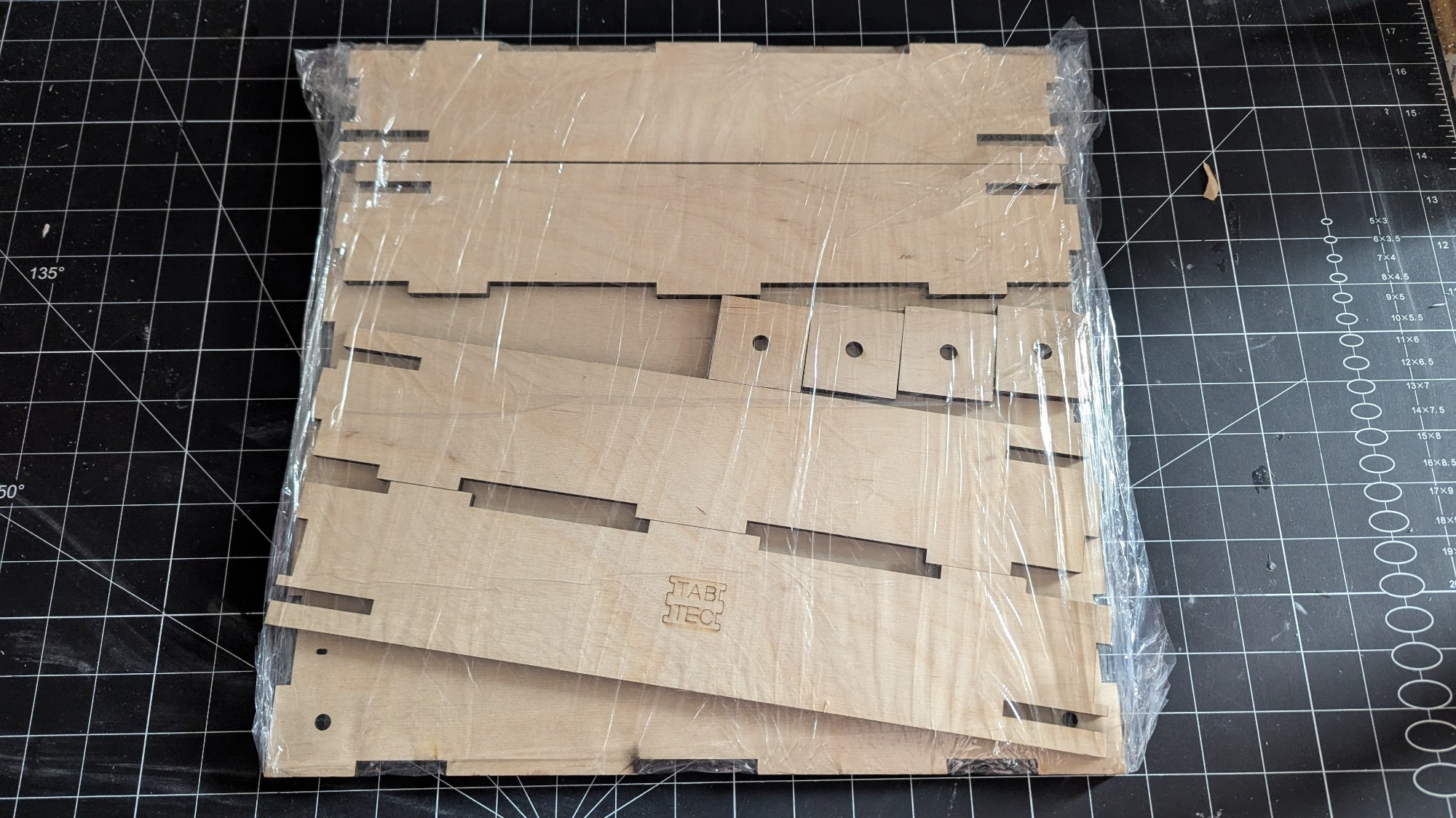 This is an unassembled corner T-Trak module.