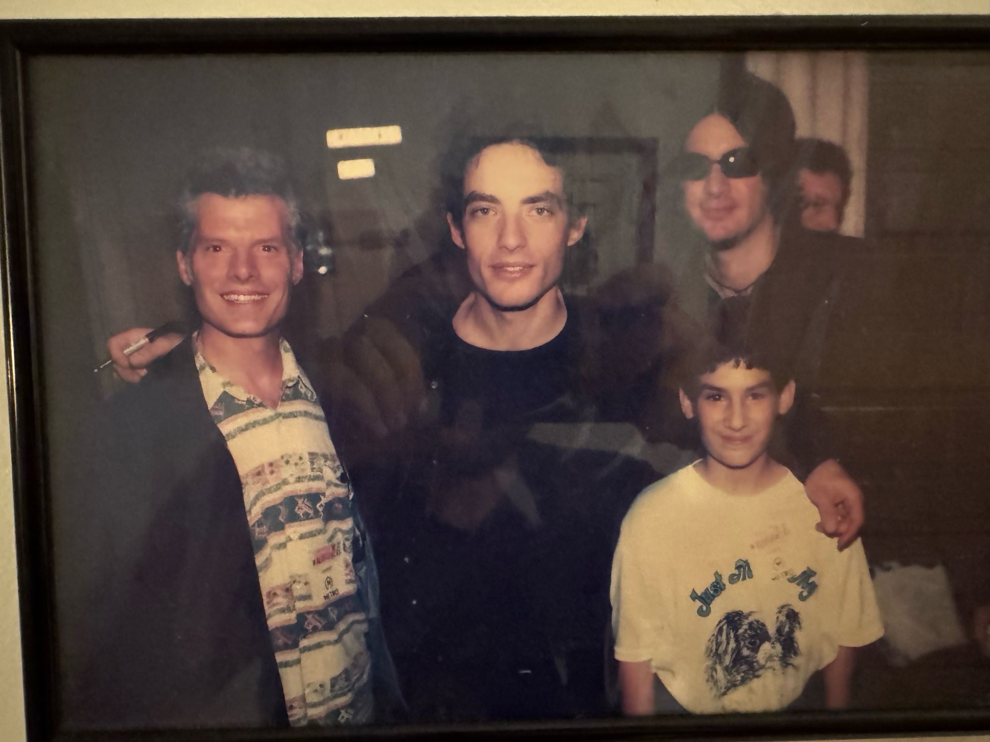 Me as a small boy with a t-shirt that says “Just me and My” with a picture of a Japanese chin. In the photo is my father, Jakob Dylan (frontman of The Wallflowers) and some other band mate.