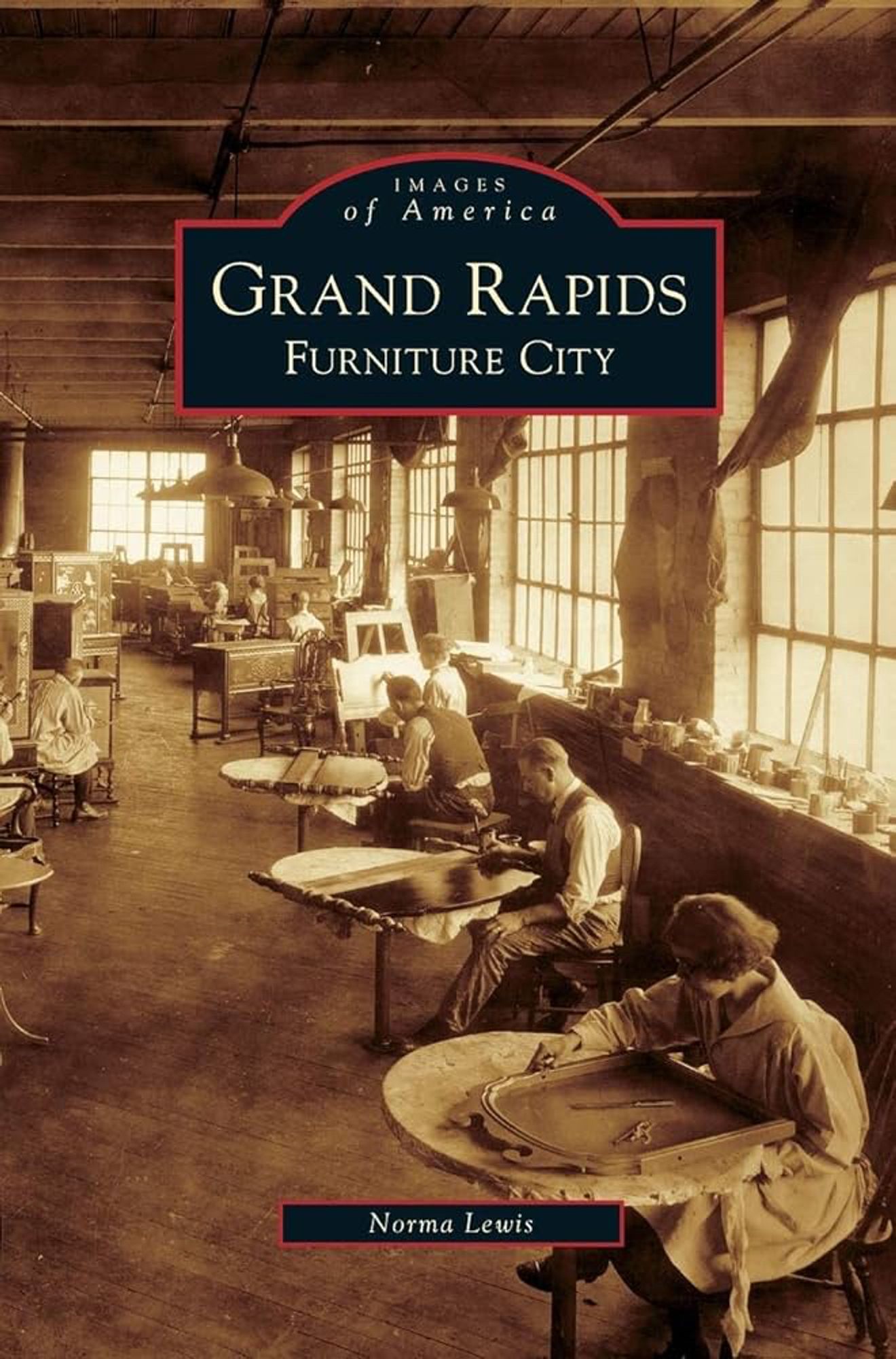 A boo cover featuring a historic sepiatone photo of turn-of-the-century workers—men and women—working inside of a furniture factory. 

The book is called "Images of America Grand Rapids Furniture City" by Norma Lewis.