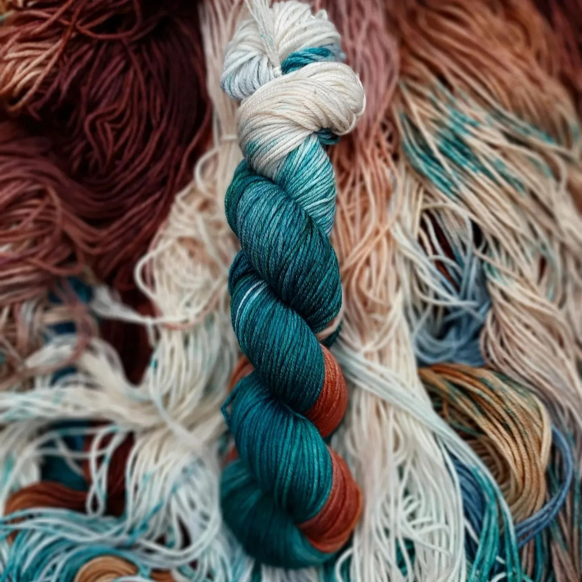 Close up image of August's yarn club colorway "mystic magi teal."