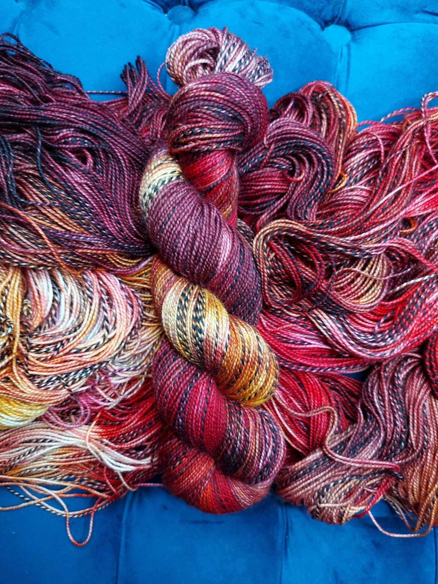 Red, gold, and black zebra pattern yarn.