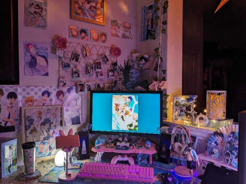 Night photo of pc setup starring nanase haruka from free anime series. Lots of blue and pink