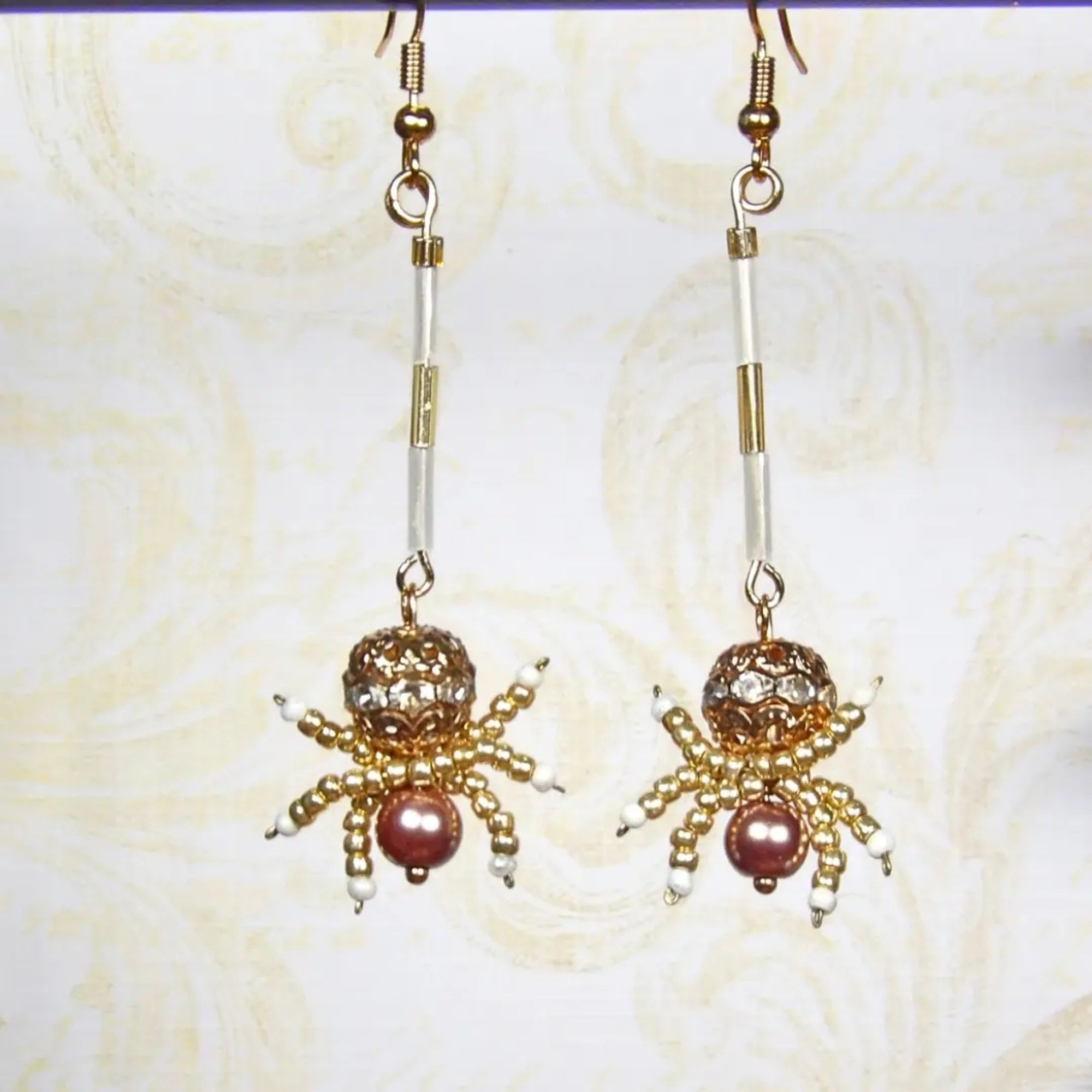 Gold spider earrings