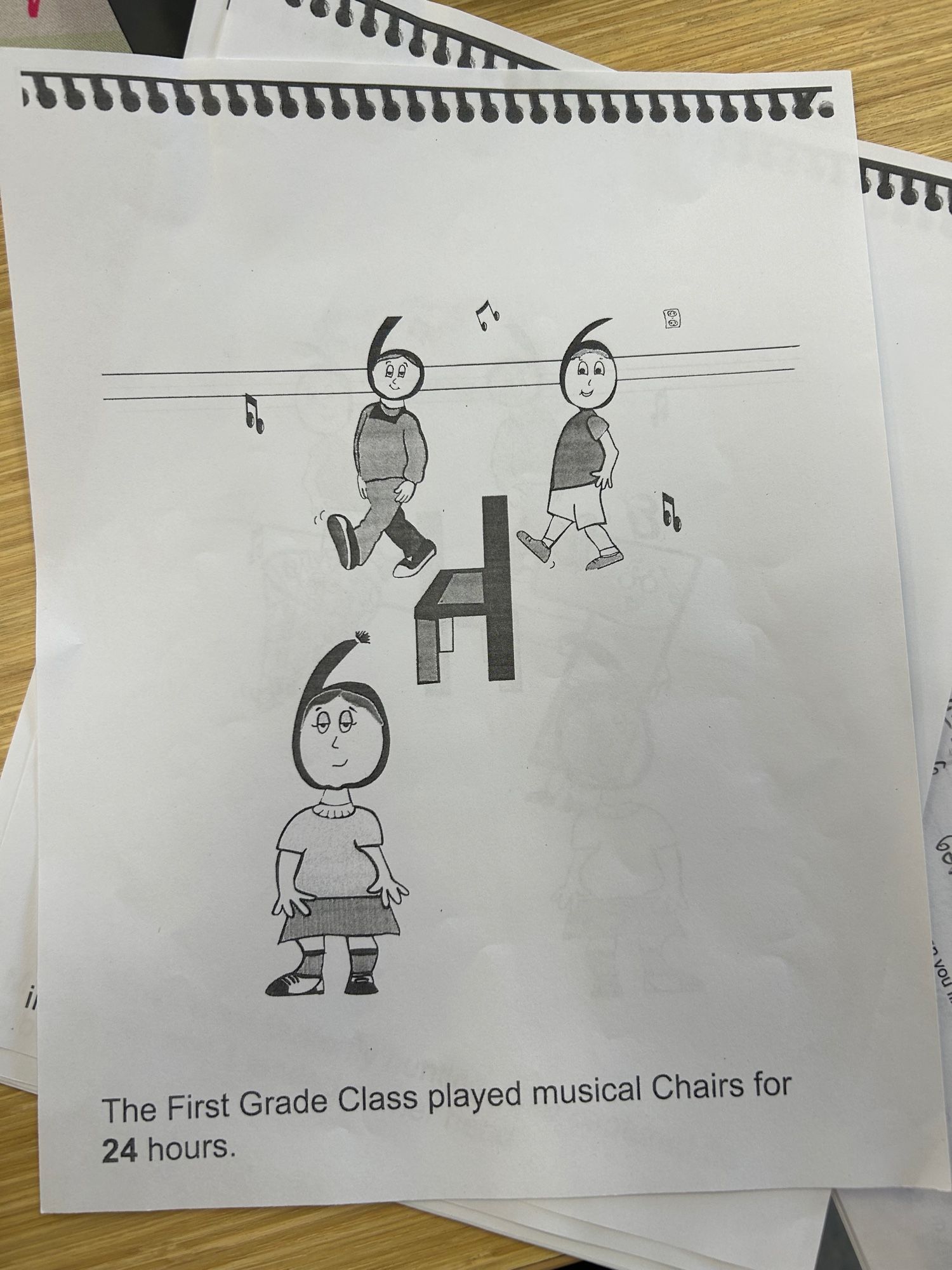 An absolute horror show of a “multiplication trick” that makes zero sense. There are 3 figures with heads appearing to be 6s and a chair whose seat is apparently meant to look like a 4. This is supposed to represent 6 x 4 =24. The bottom of the sheet reads “the first grade class played musical chairs for 24 hours.”