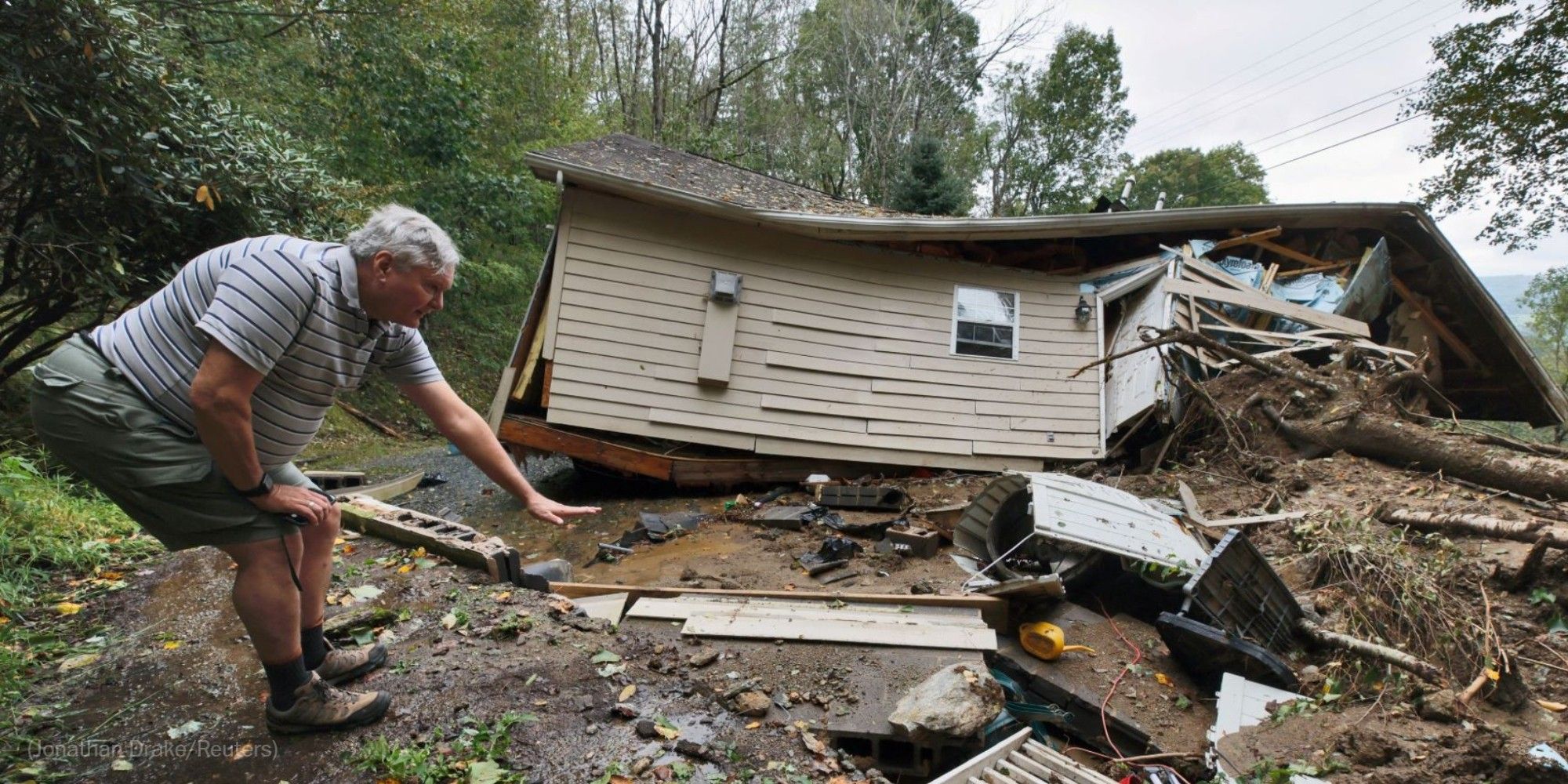 Scott Richardson points to where his home’s foundation once stood in Boone, N.C., on Saturday. Photo by Jonathan Drake for Reuters.