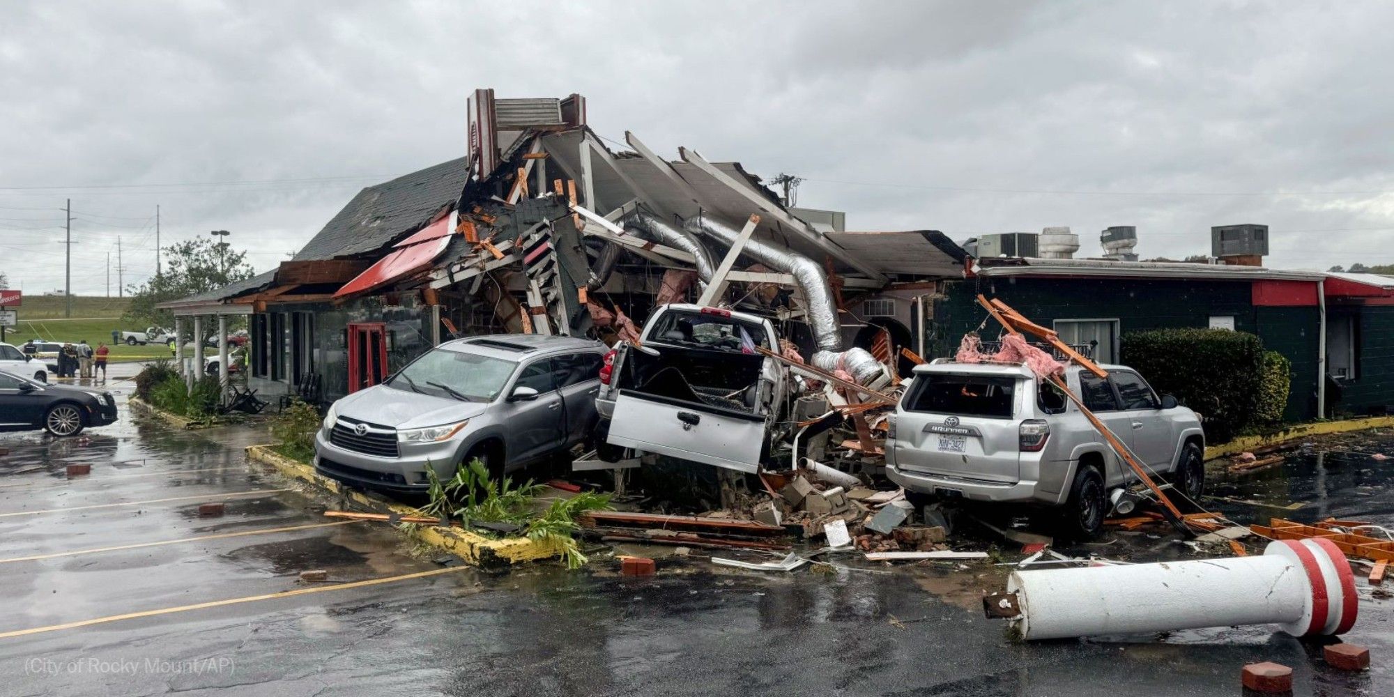 Cars are piled along the side of Hing Ta Restaurant after a tornado hit Rocky Mount, N.C., on Friday. Photo by the city of Rocky Mount for AP.