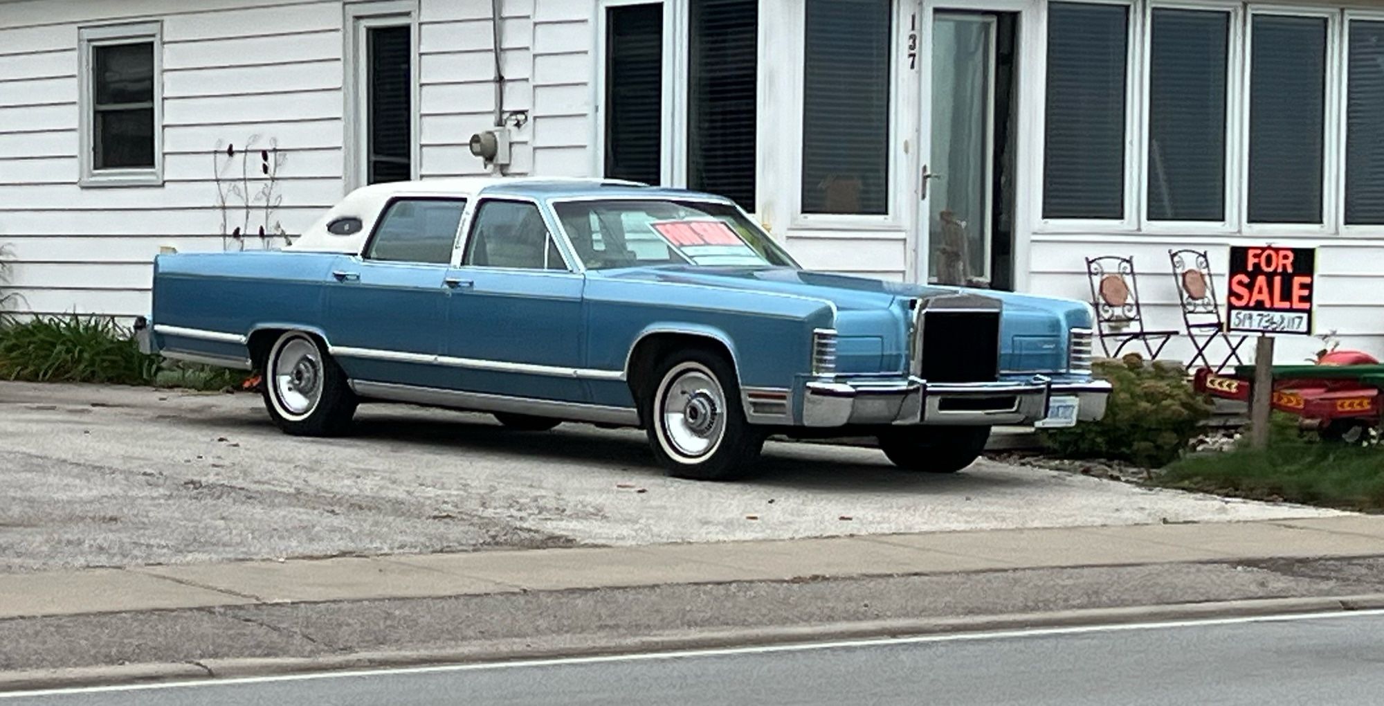 Light blue 70’s lincoln cruise liner