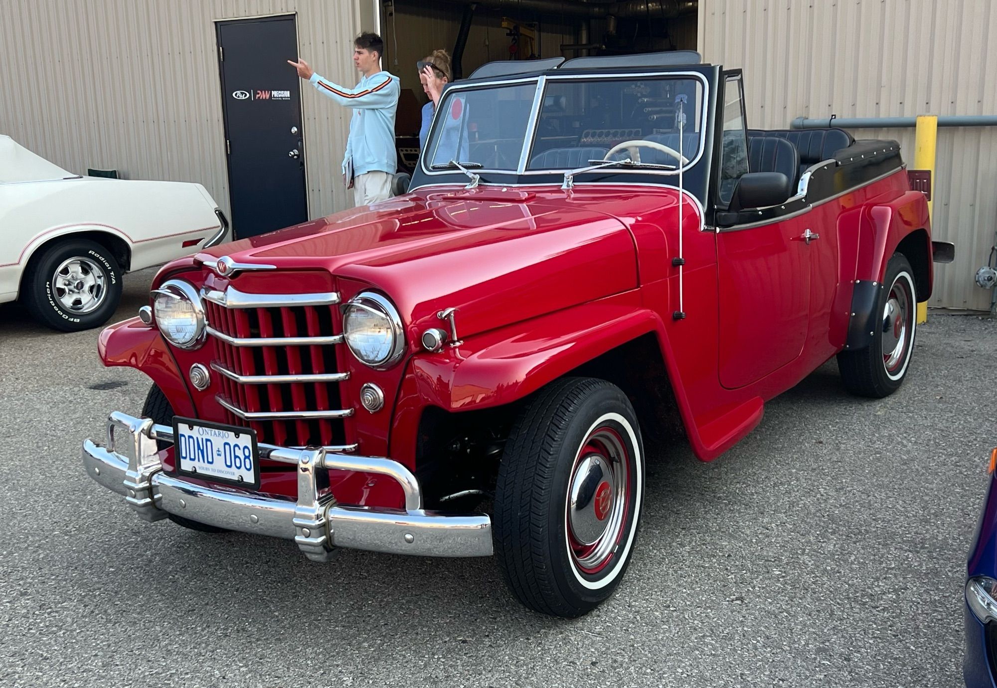 A very nice shade of red on an old willys “jeep” vehicle.