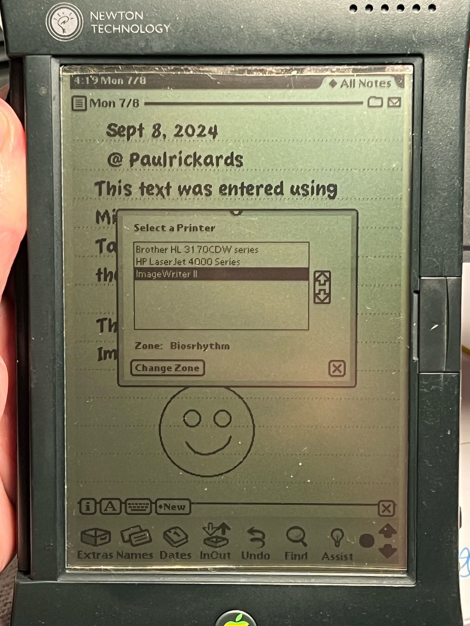 Screen of a Newton MessagePad 2100 with the document and a slip for selecting a printer. Three printers are shown and the ImageWriter Il is selected.