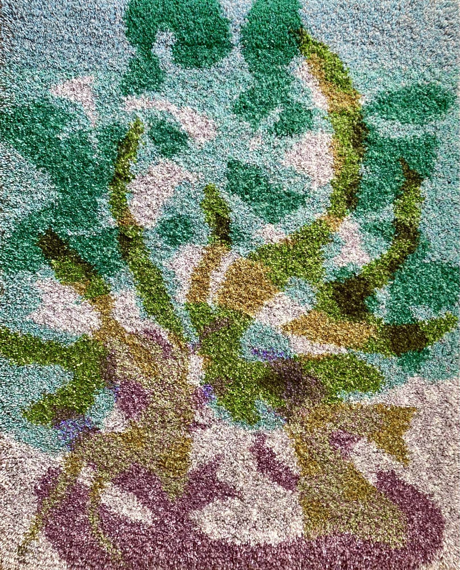 A vertical thick-pile wallhanging (rug) depicting an abstracted flames and smoke clouds in solid colour shapes. The background colours are pale teal and warm grey overlaid with purple shapes on the bottom of the composition and yellow-green arcing flames reaching for the top. Dark green shapes are formed by overlapping green and teal shapes. Info: Untitled Fire Cloud (Pyrocumulus) 9, hand-knotted wool yarn on cotton warp, 98 cm x 79 cm, 2024.