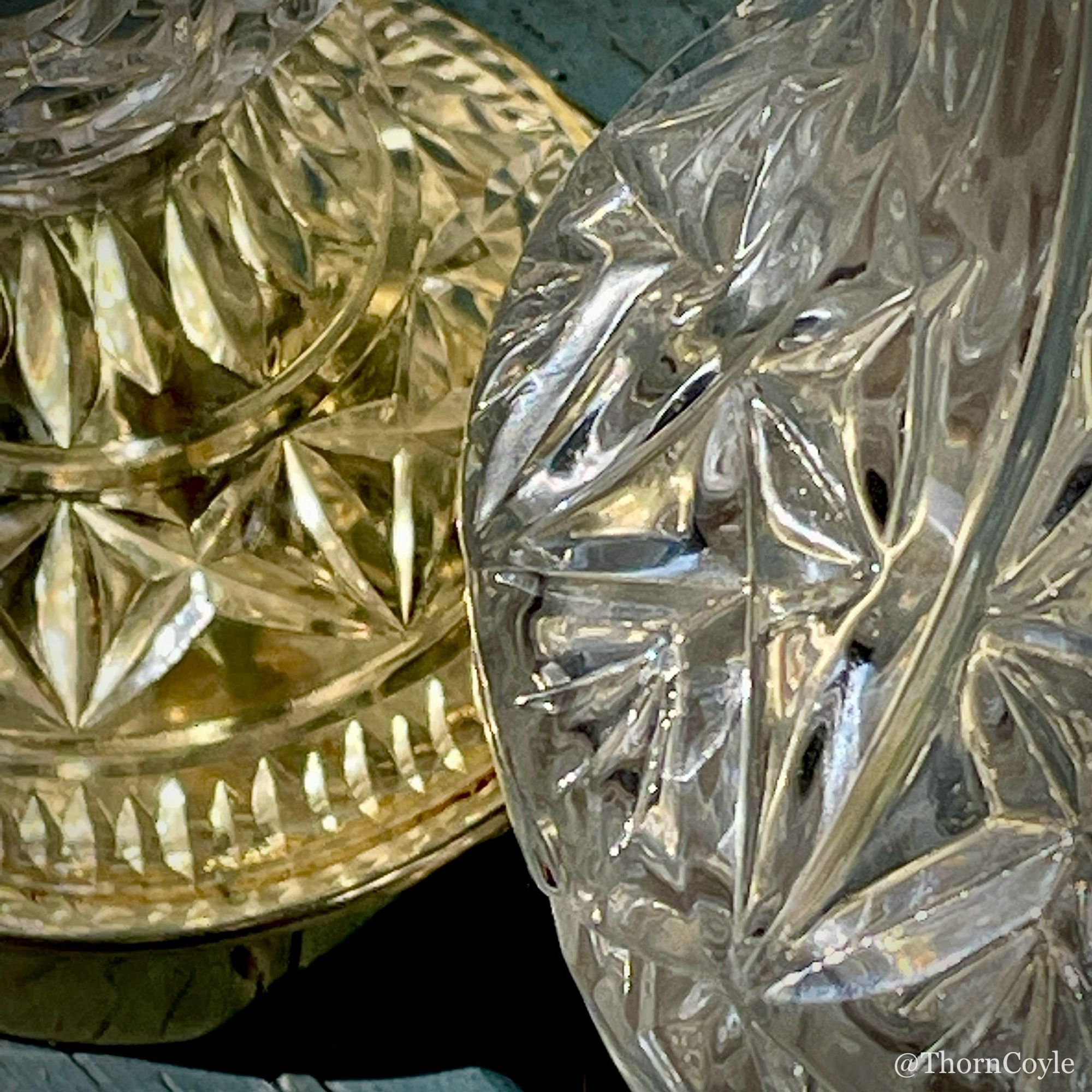 Close up of the bases of two cut crystal lamps.