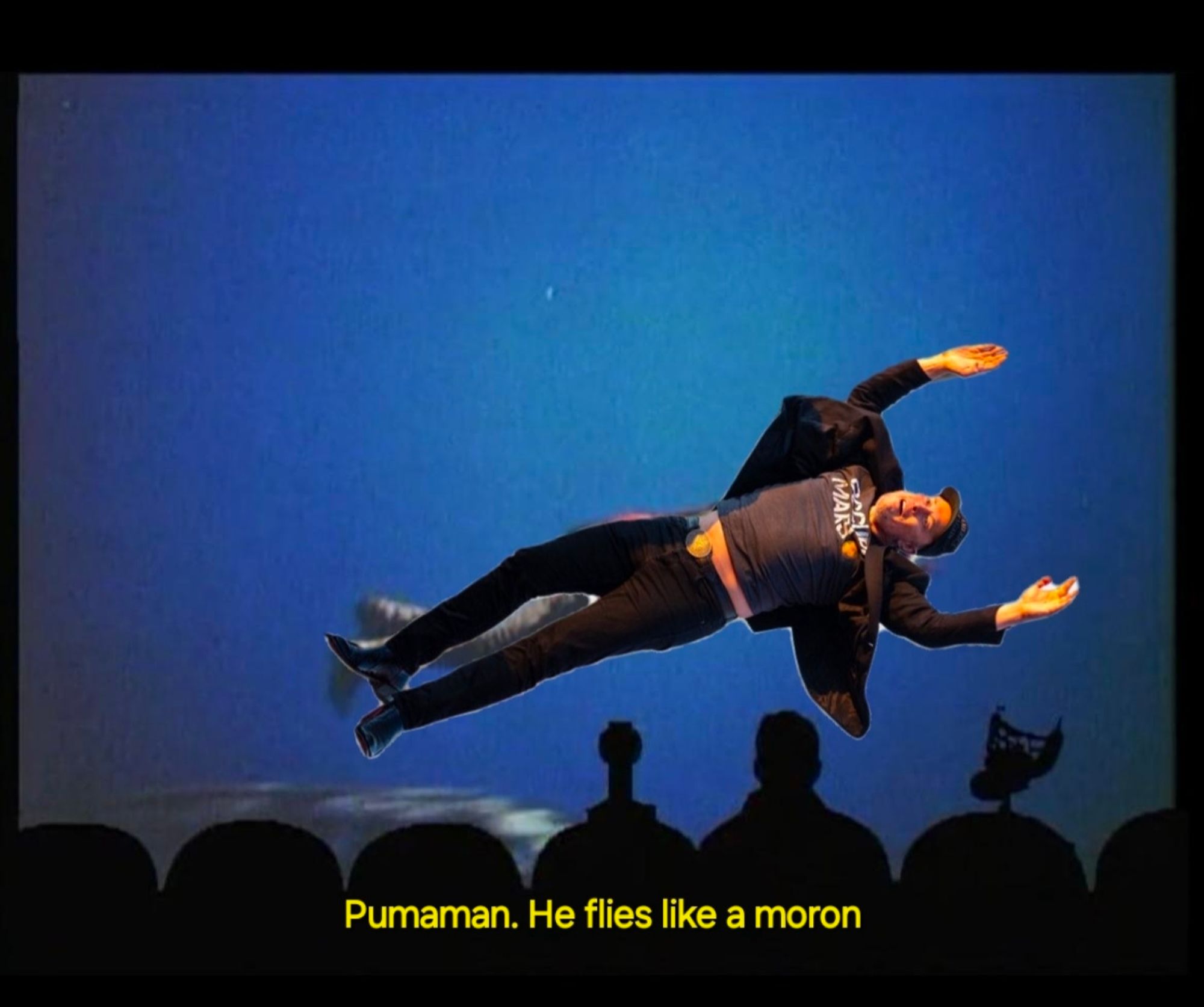 Elon Musk over Pumaman flying from the mst3k riff of the movie Pumaman with text that reads "Pumaman. He flies like a moron."