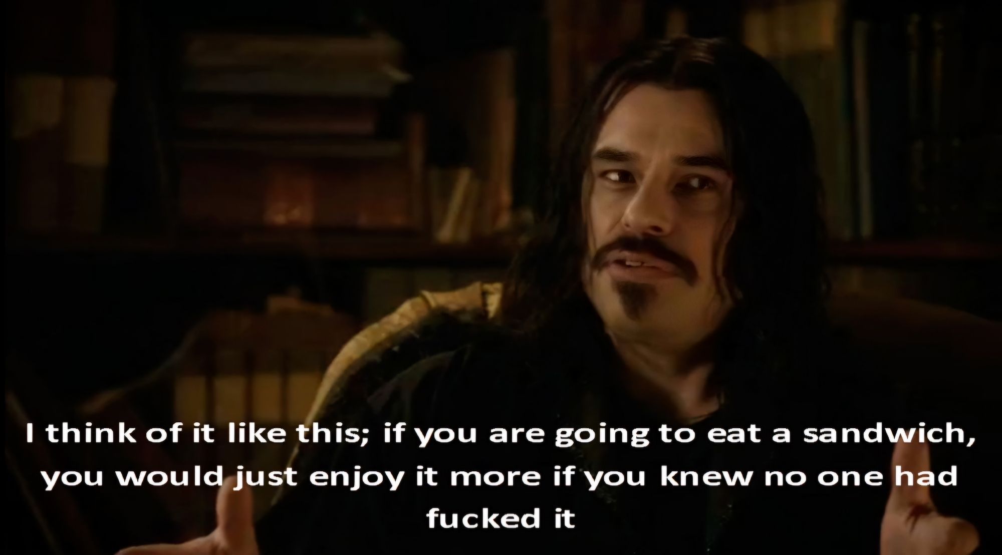 Still from the movie What We Do in the Shadows showing Vladislav doing a talking head. Text reads "I think of it like this; if you are going to eat a sandwich, you would just enjoy it more if you knew one had fucked it"