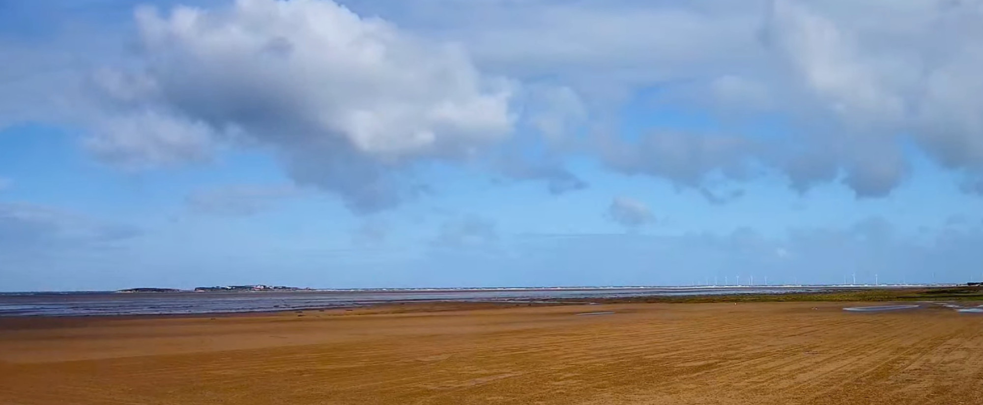 West Kirby beach with Hilbre Island on the horizon.