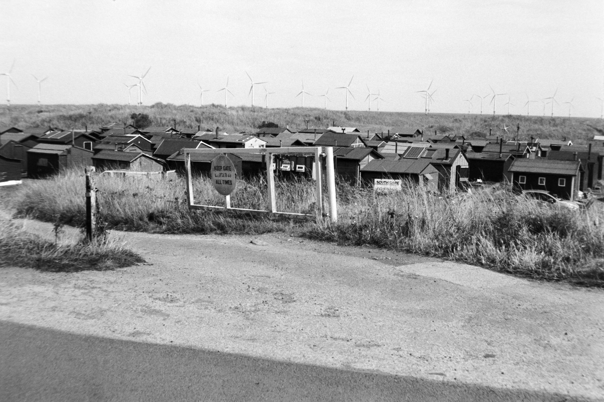 Huts. Roofs of huts, as if they are in a depression.