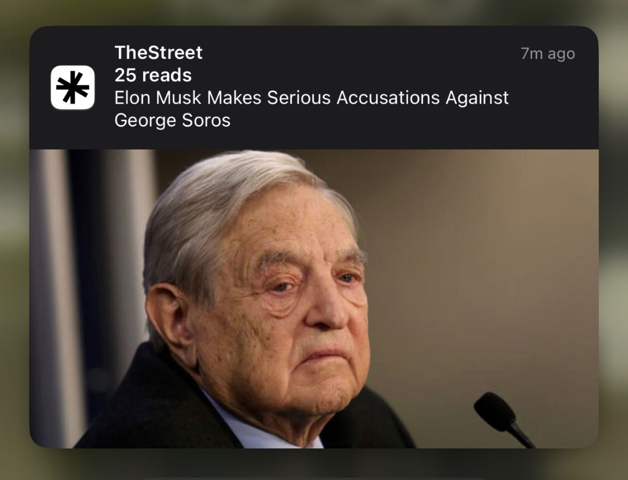 Push notification from TheStreet that reads: “Elon Musk makes serious accusations against George Soros”