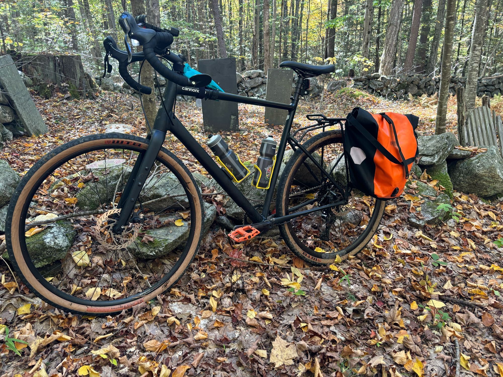 Black bike in front of an old cemetery in the woods!