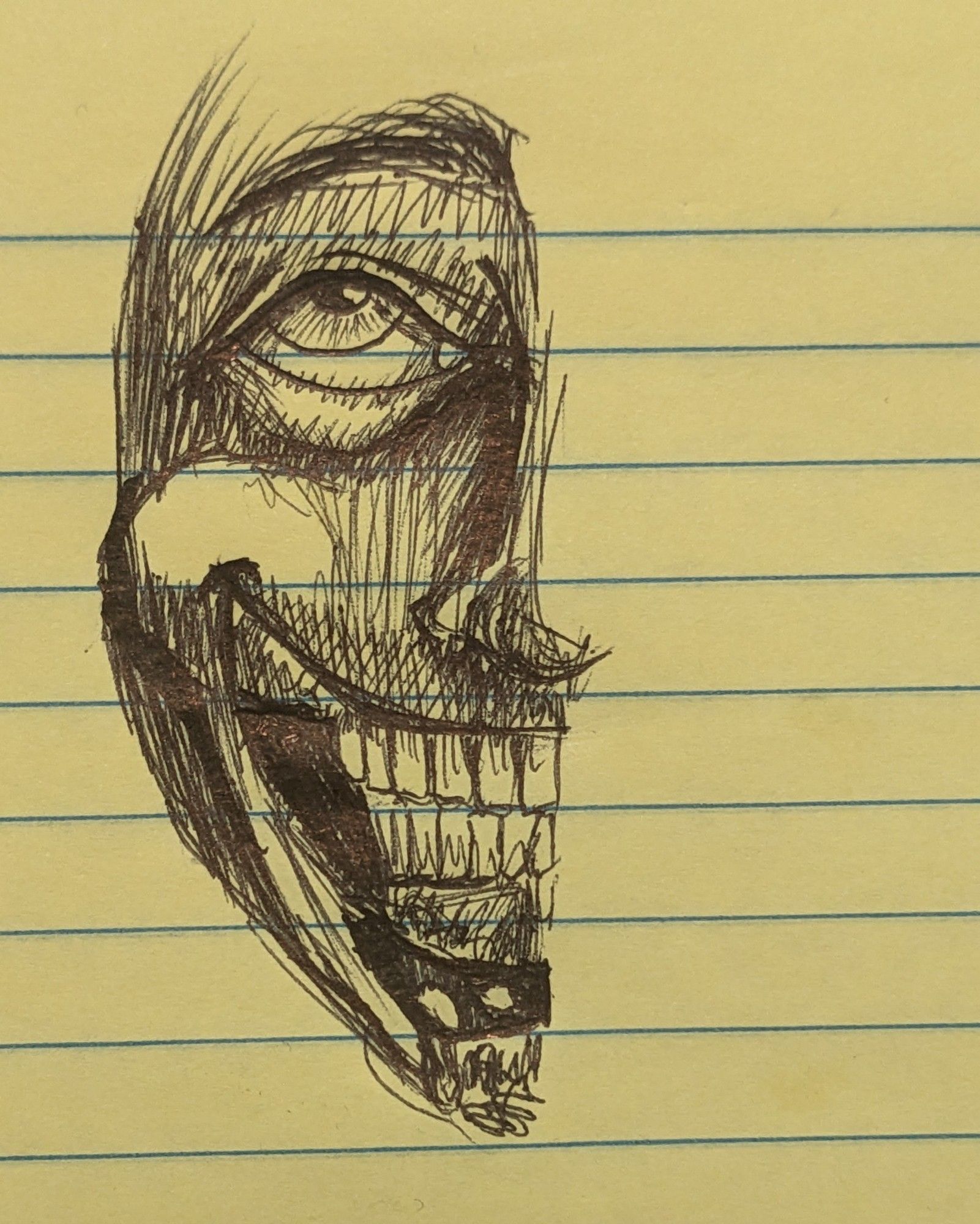 Pen scribble of half a face with creepy grin