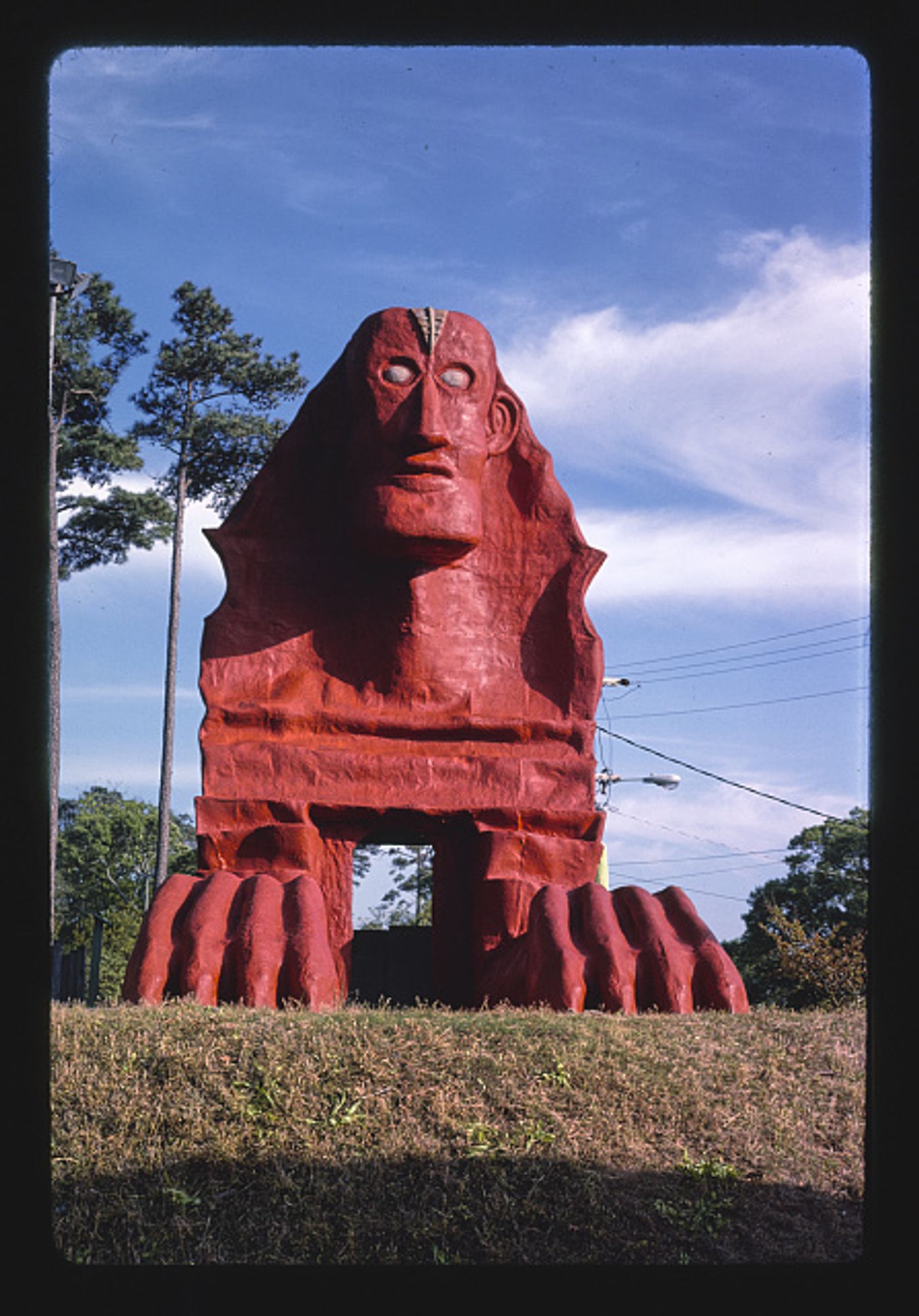 Truly terrifying red sphinx statue, with dead eyes, at Wacky Golf in North Myrtle Beach, South Carolina, circa 1970s