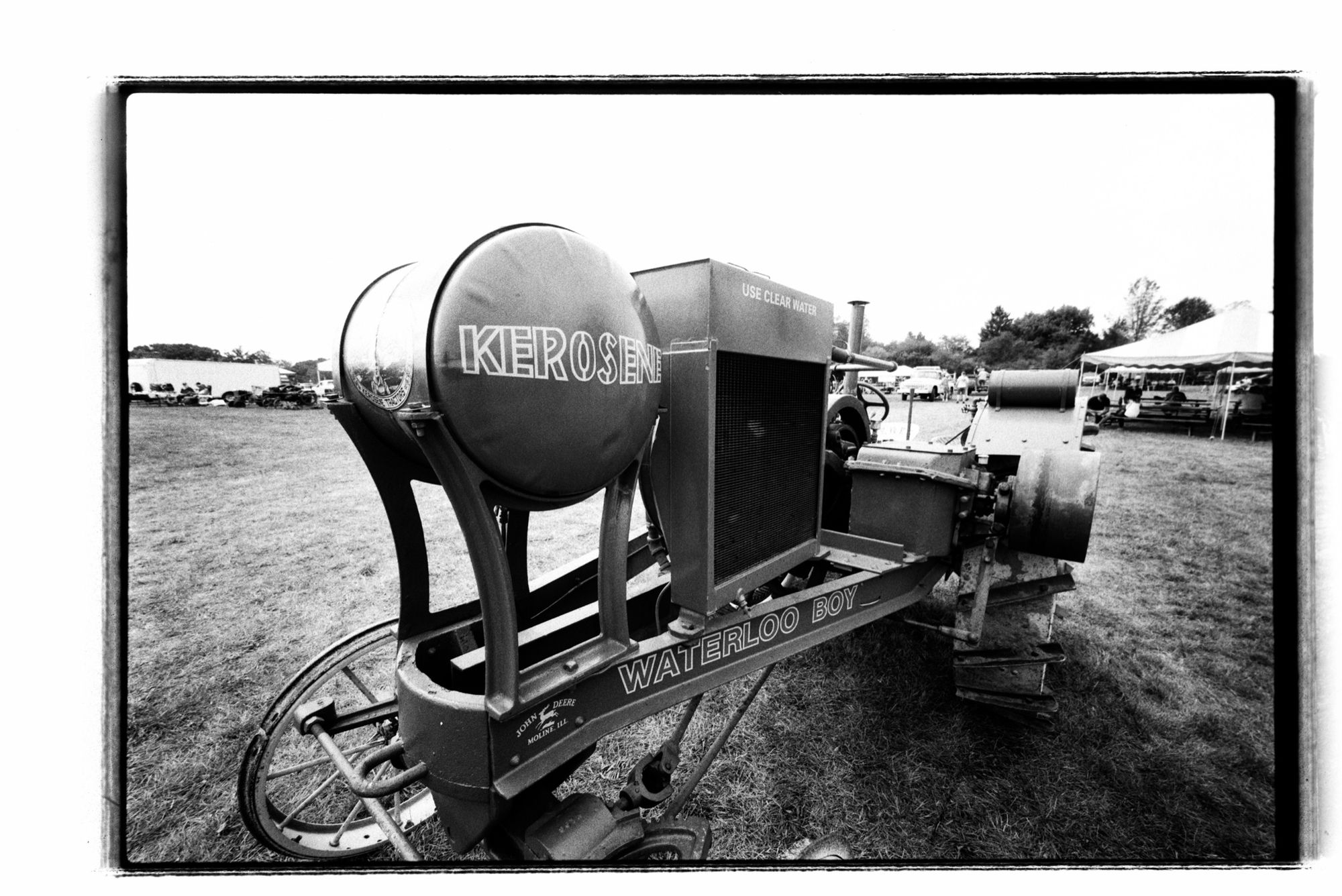 A black and white photo of a John Deere Waterloo Boy kerosene-powered tractor. John Deere purchased Walloon in 1918 and used the name on tractors until 1923.