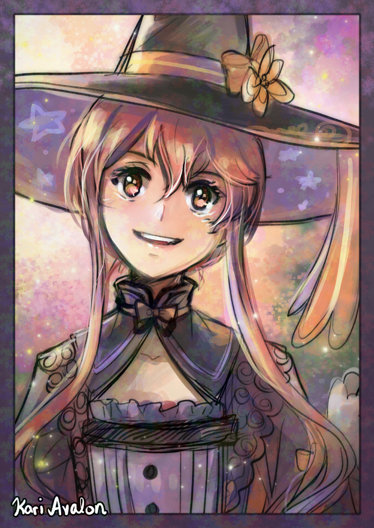 A portrait of a smiling girl wearing a witch’s hat.