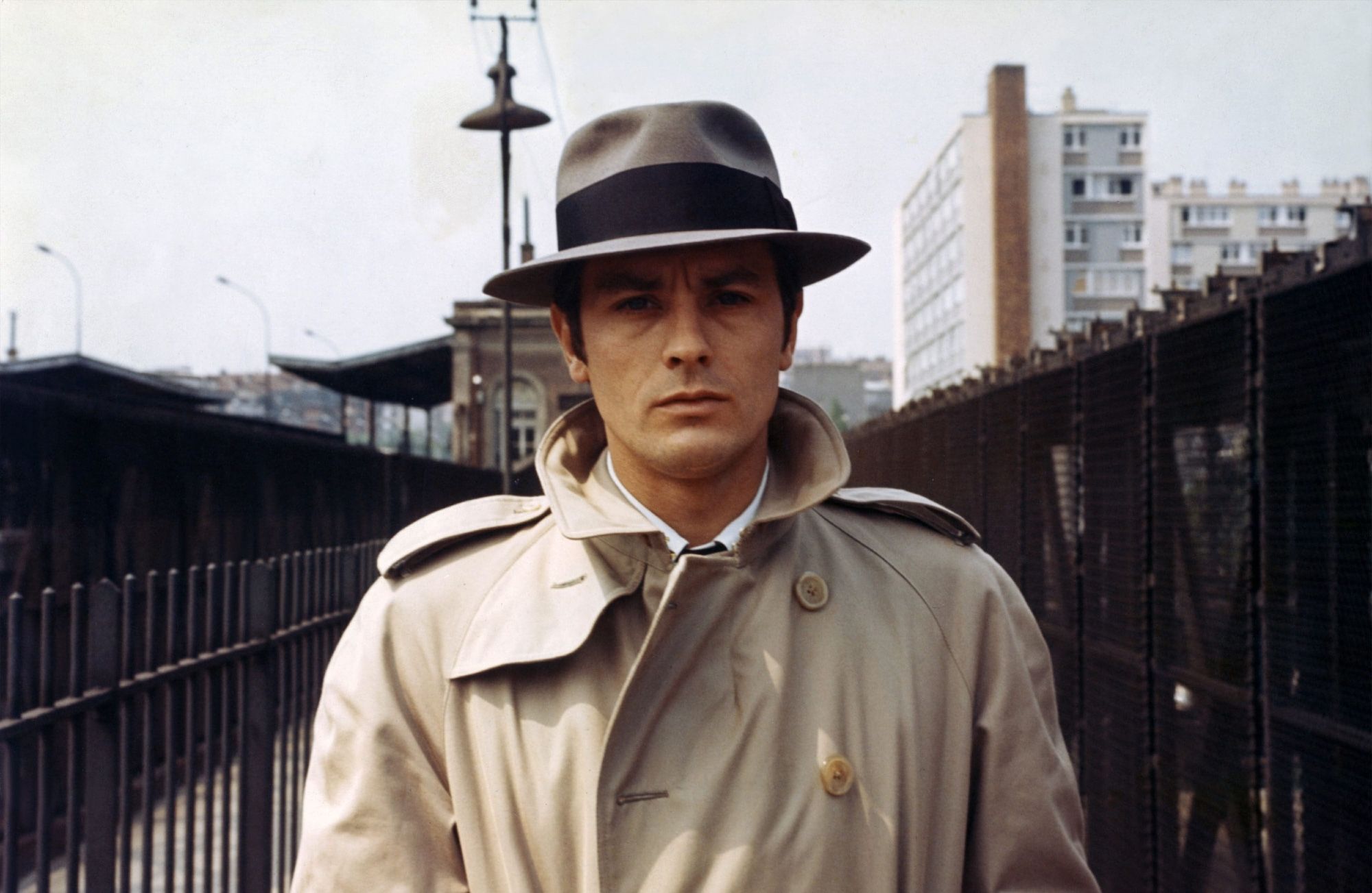 Alain Delon looking inscrutable in fedora and raincoat as the contract killer in Le samouraï.