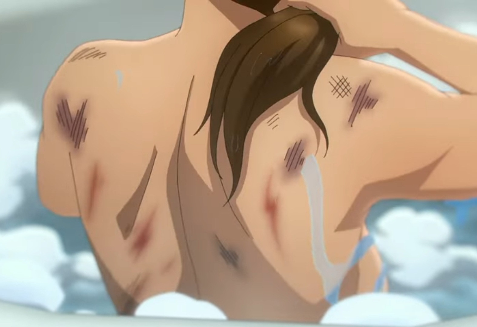 screenshot of the tomb raider show festuring laura crofts muscular back, covered in bruises