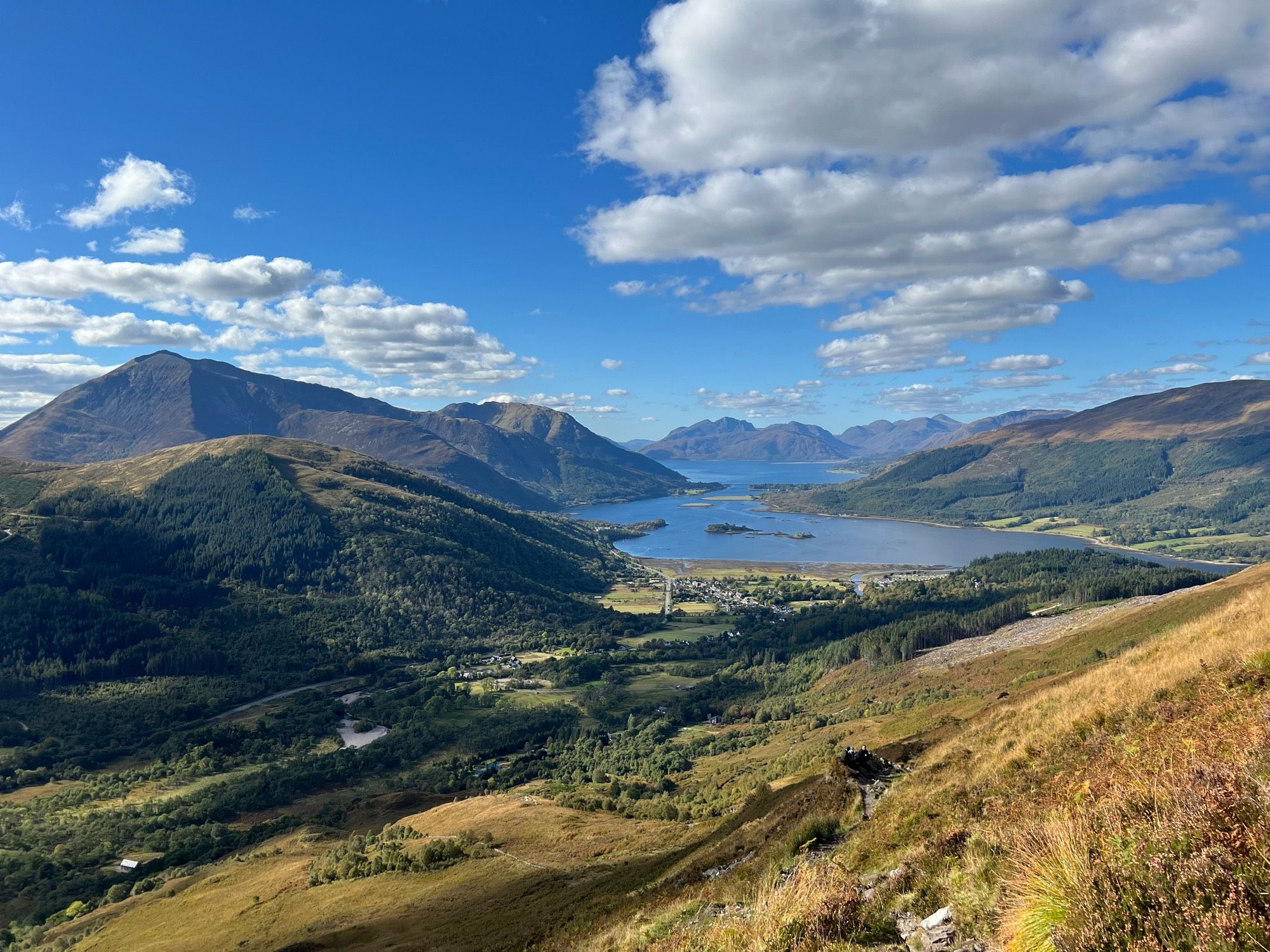 Loch Leven from the slopes of Sgorr Nam Fionnaidh. The loch is a perfect deep blue colour, as is most of the sky.