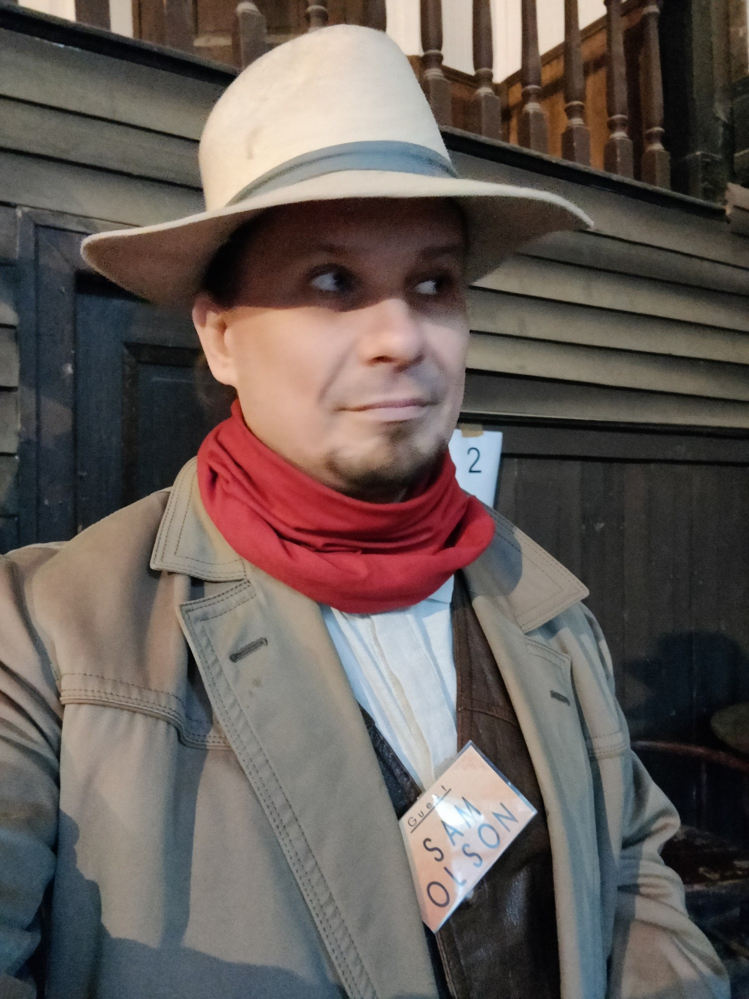 Myself in my western larp costume with character name tag reading Sam Olson.