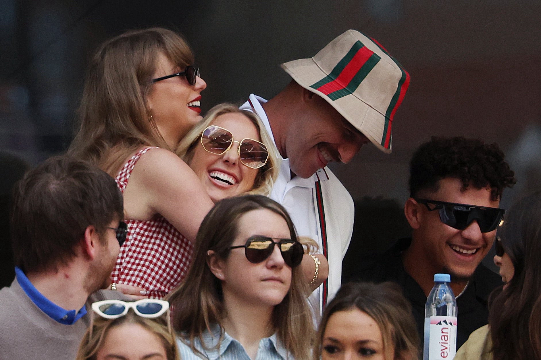 Taylor Swift hugging a Nazi woman at a football game