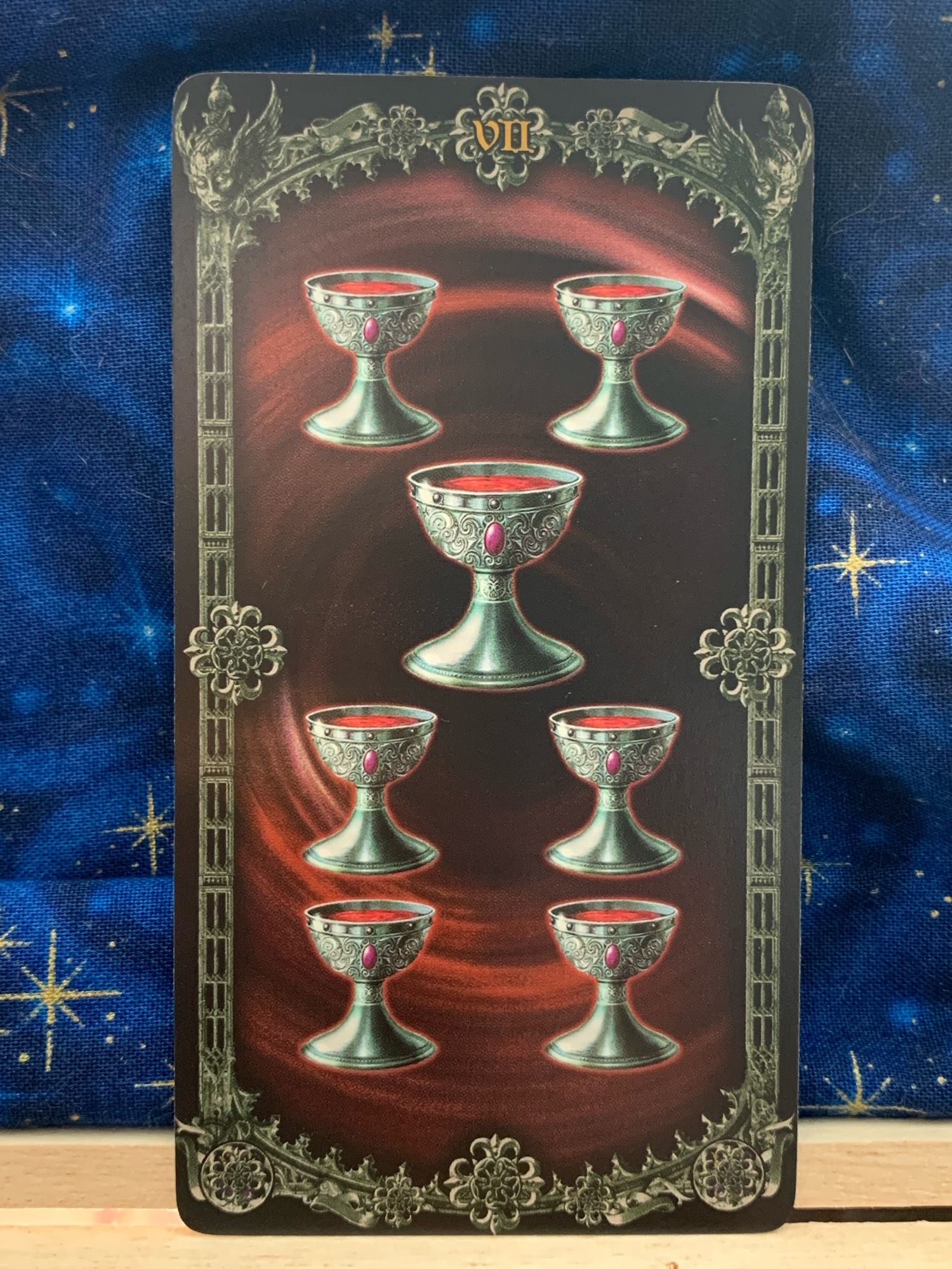 Photo of the 7 of Cups pip card from Alchemy 1977 England Tarot.