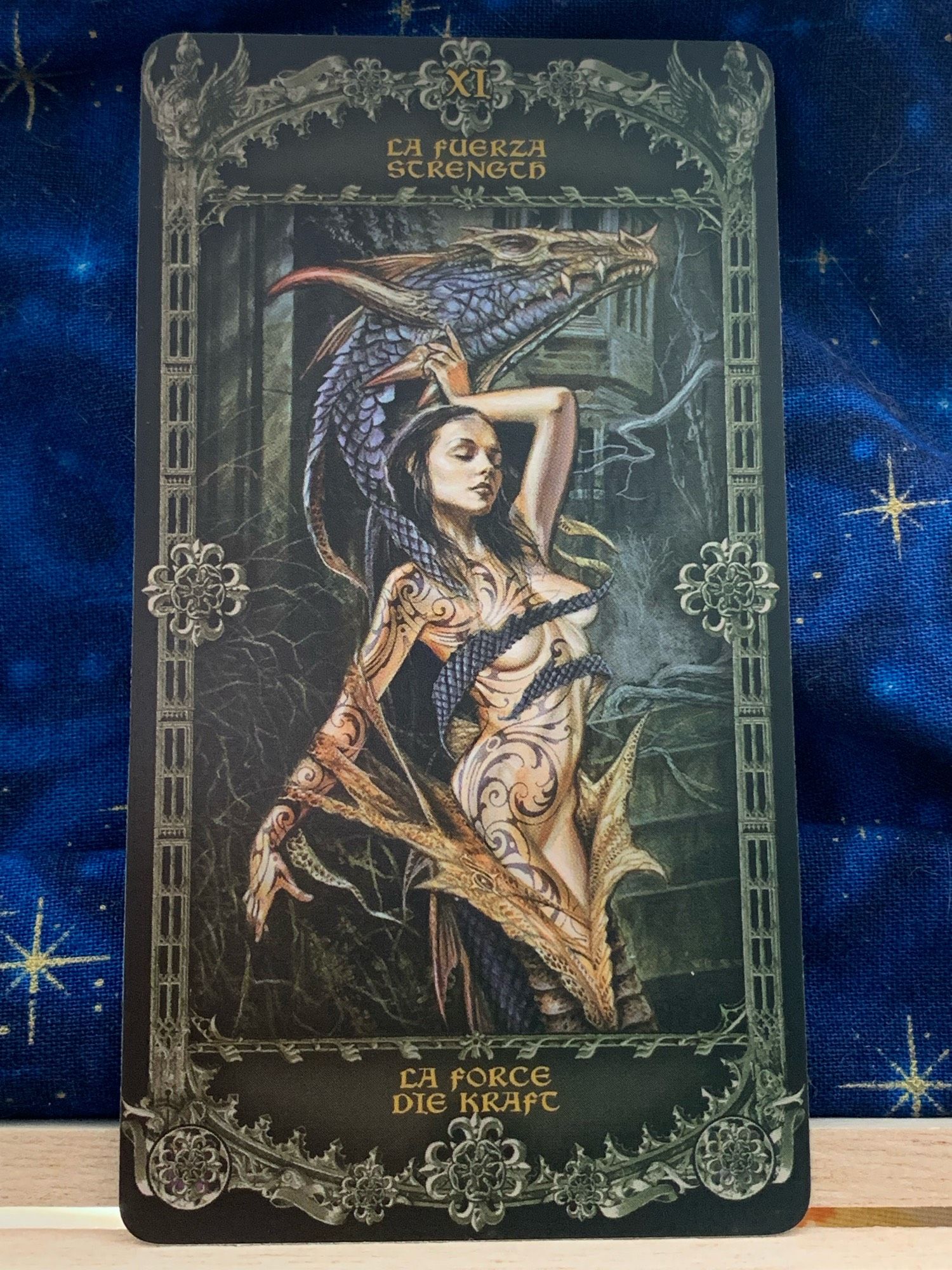 Photo of the Strength. card from Alchemy 1977 England Tarot.