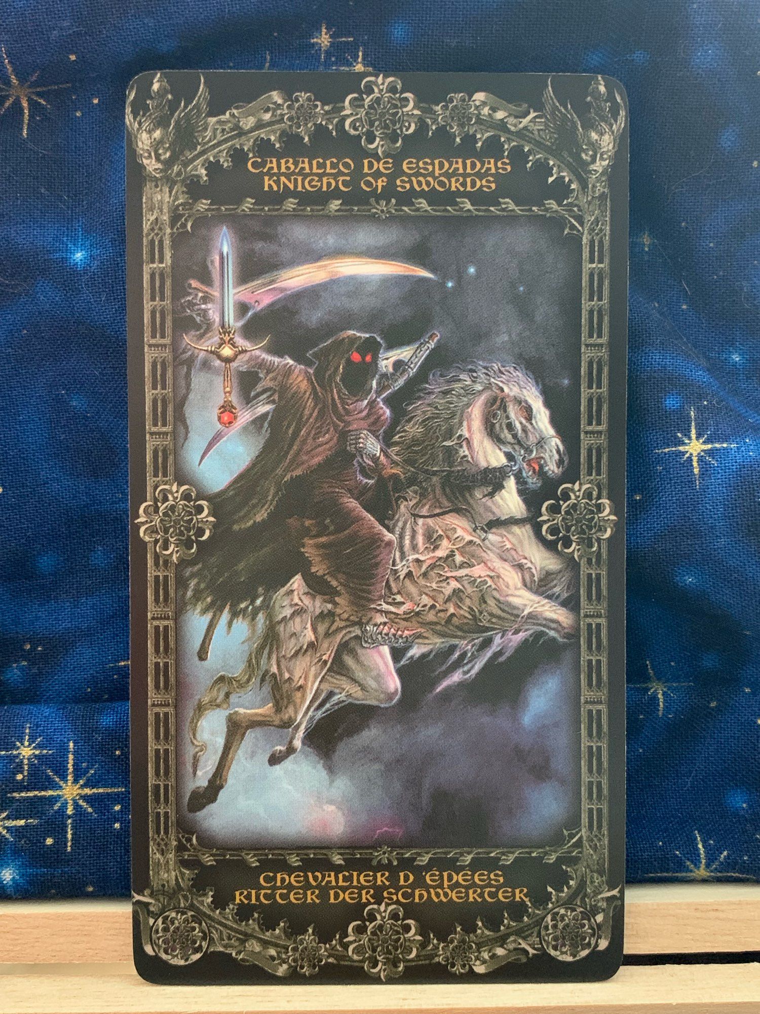 Photo of the Knight of Swords card from Alchemy 1977 England Tarot.