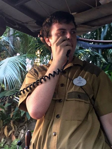 Me back when I worked as a Jungle Cruise skipper! I'm 6 feet tall, white skin with black hair, and I'm holding a microphone while working at the Jungle Cruise. I was 22 or 23 when this photo was taken.