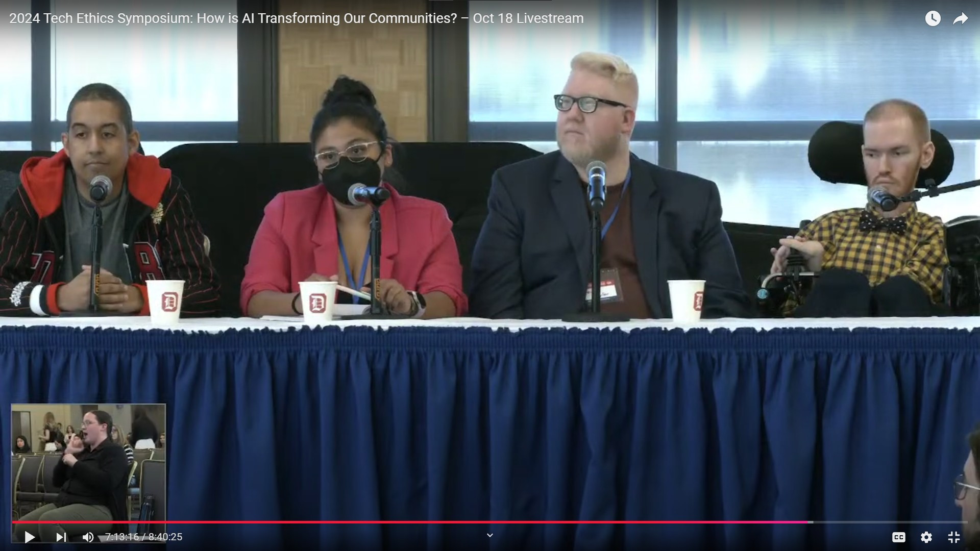 Screenshot of the panel, sitting from left to right is Chris, Kate, Steve, and Grant. With a small camera view of the ASL interpreter at the bottom left corner.
