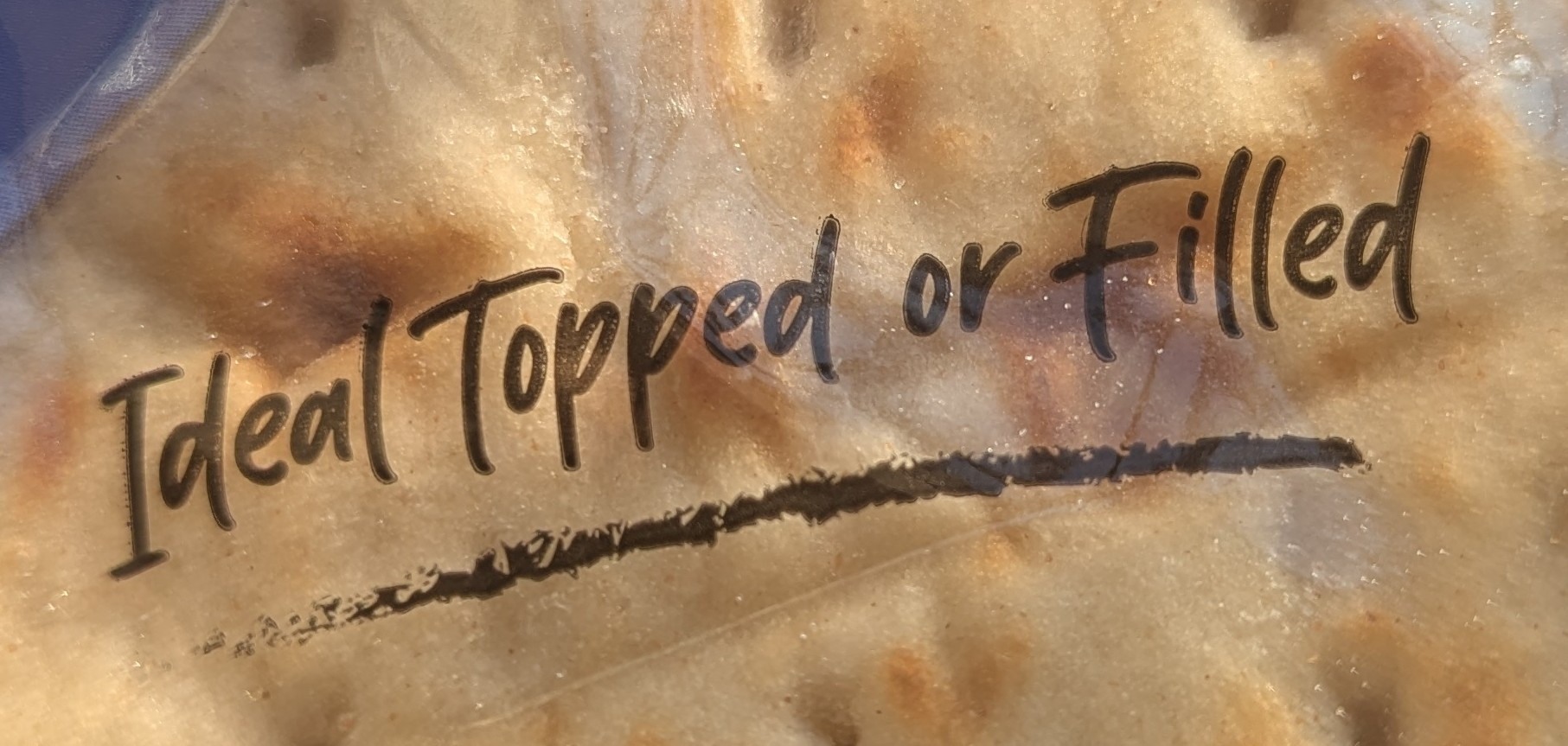 Bread packaging saying "Ideal topped or filled"