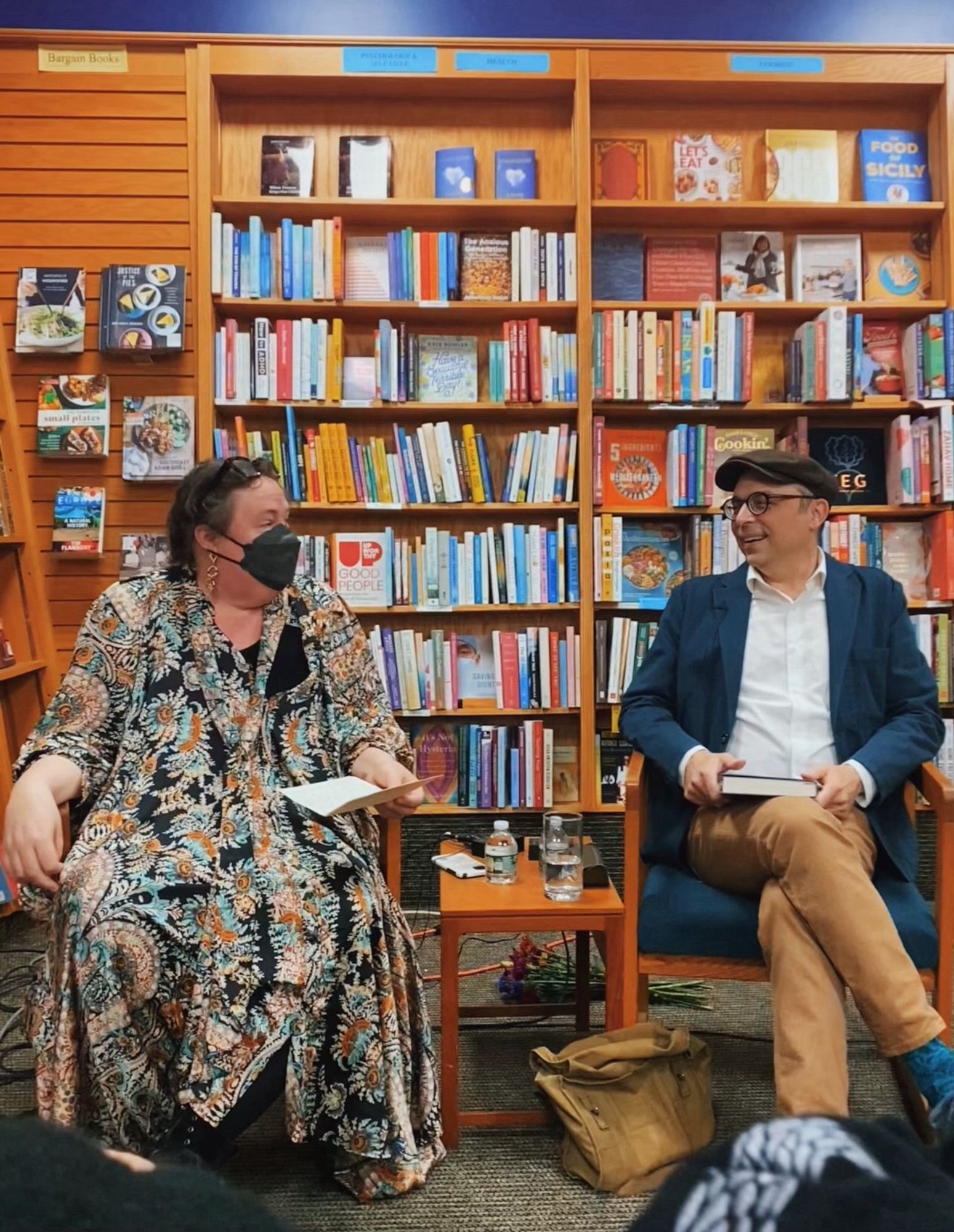 Kelly Link and Jedediah Berry seated and engaged in conversation at Odyssey Books in South Hadley, MA. (Photo by GennaRose Nethercott.)