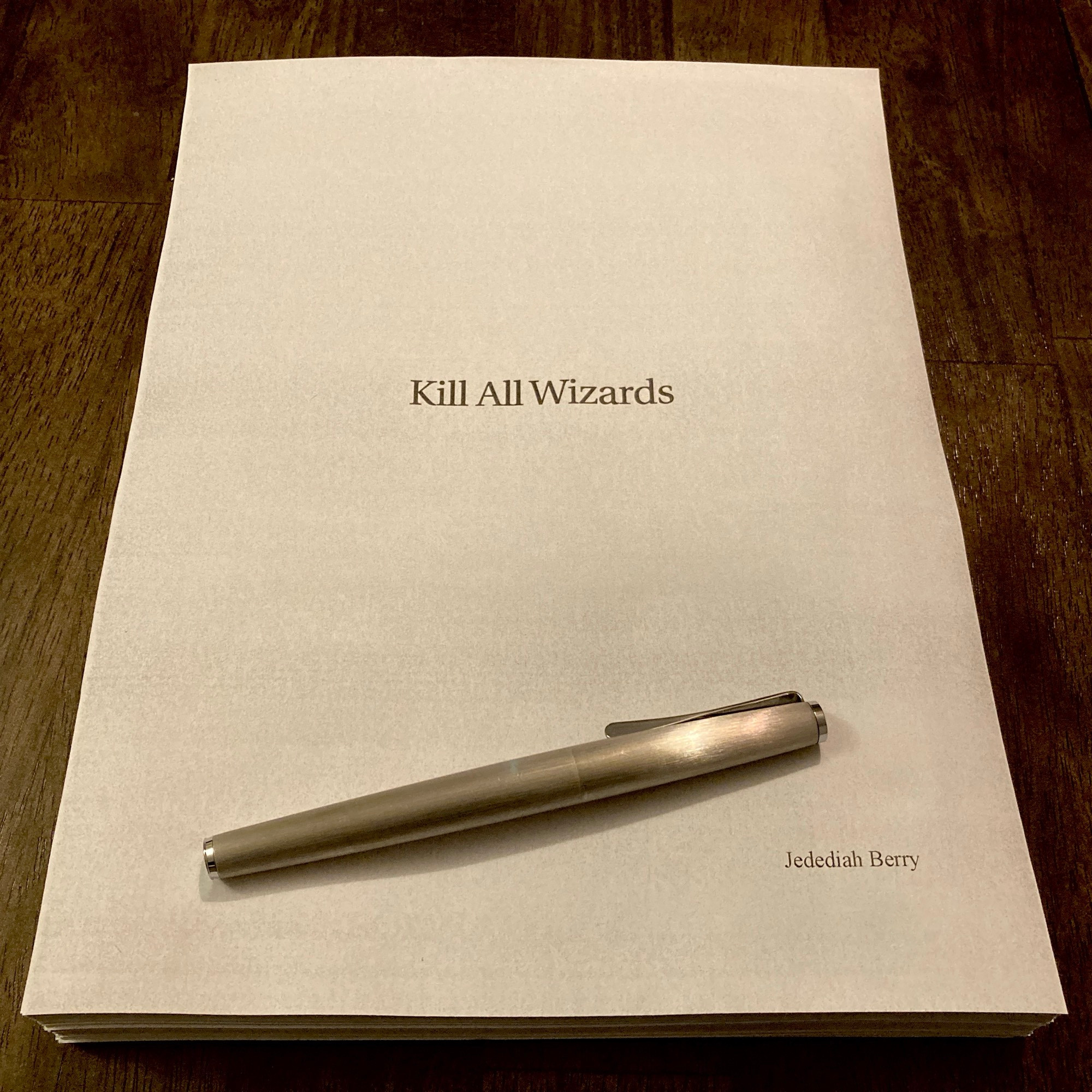 Printed manuscript bearing the title KILL ALL WIZARDS. Also a brushed metal fountain pen.