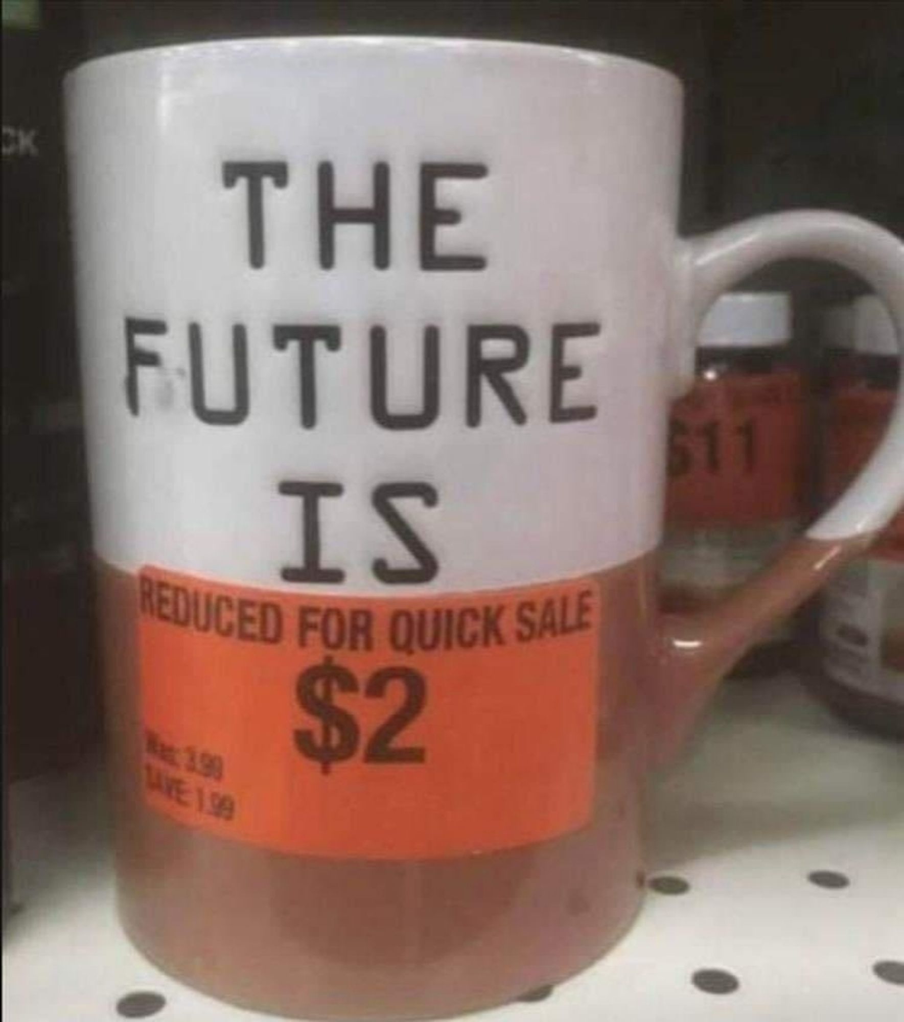 mug saying the future is with the bottom part covered by a sign saying reduced for quick sale 2 dollars

