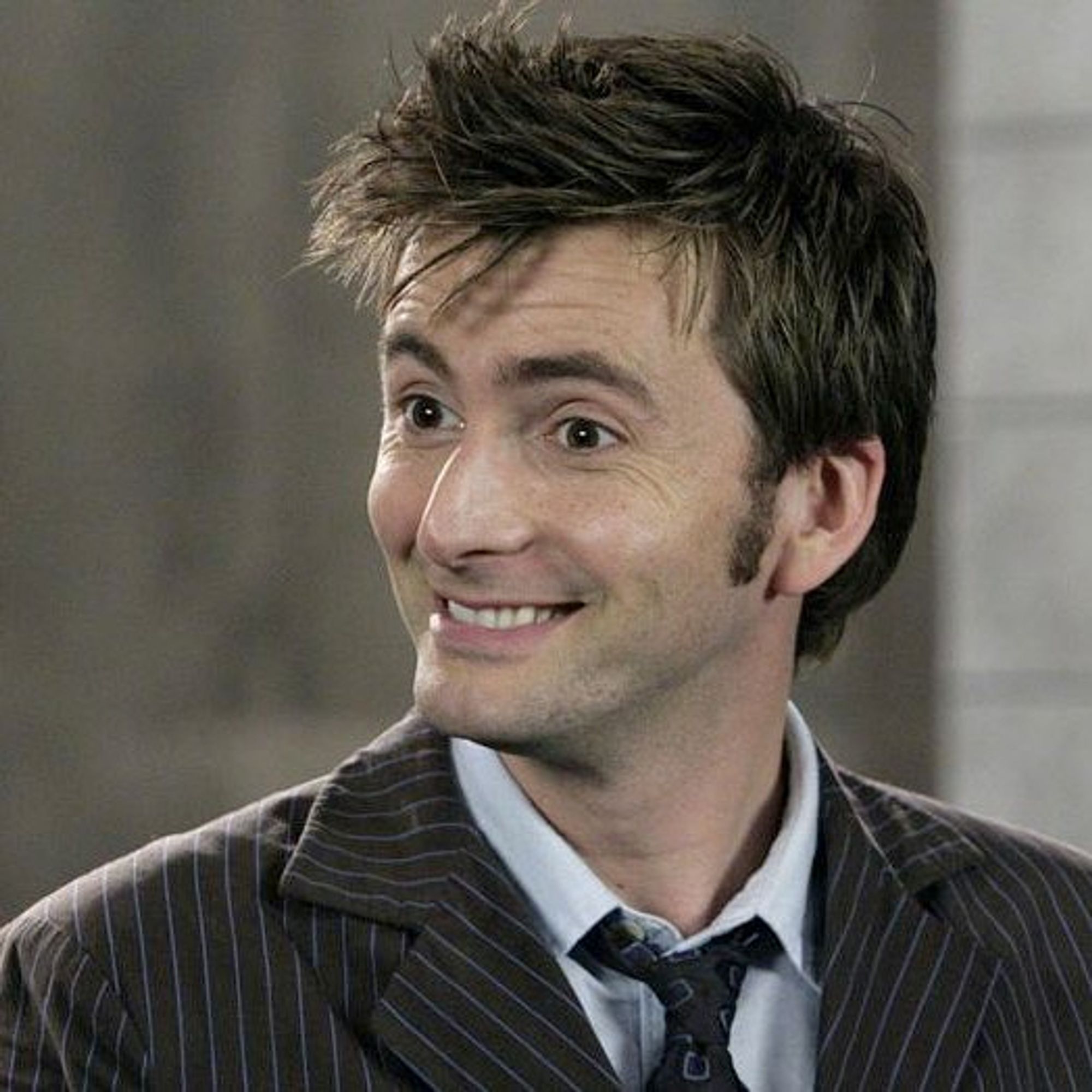 david tennant as the tenth doctor looking delighted