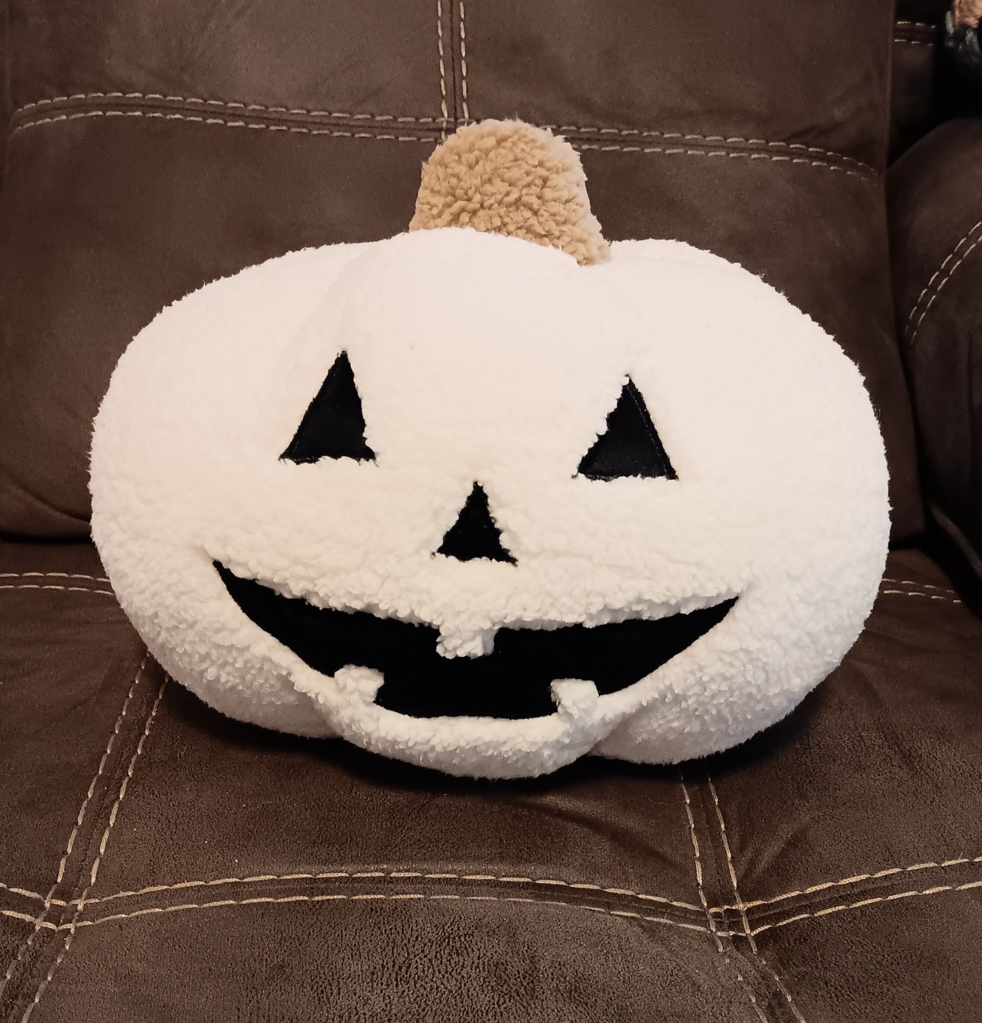 White sherpa jack-o-lantern pillow