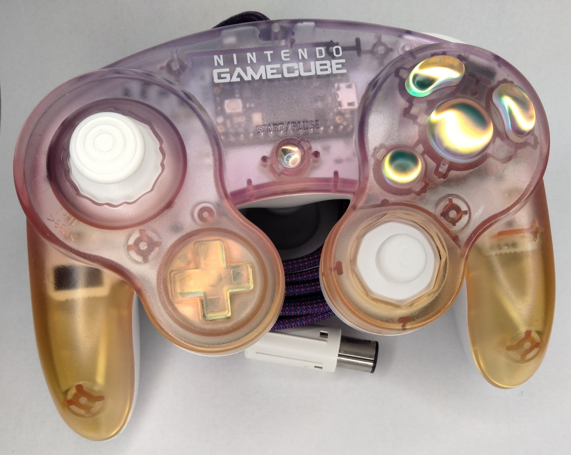 A transparent custom Gamecube controller with a sunset aesthetic