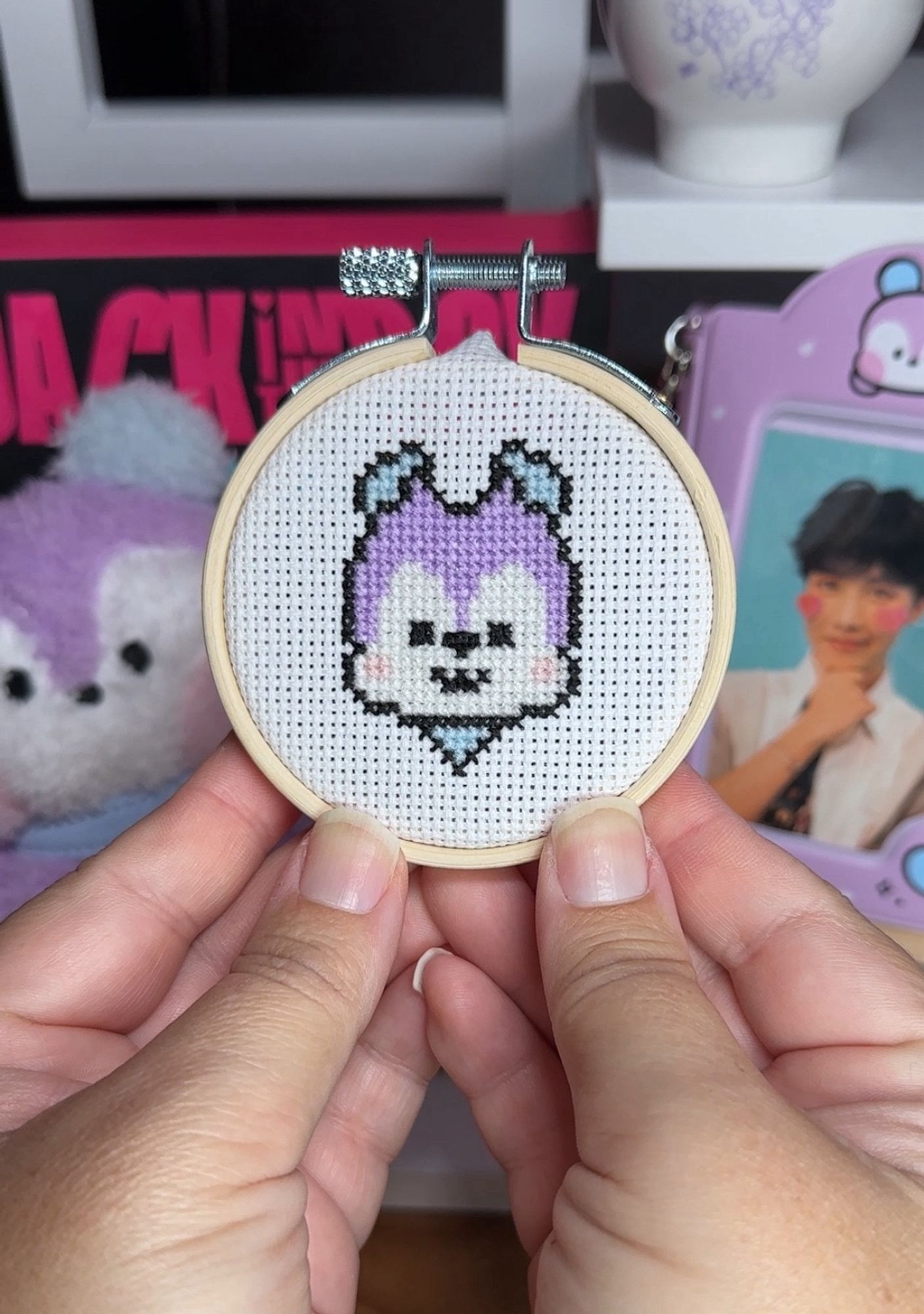 a tiny cross stitch of the bt21 character Mang