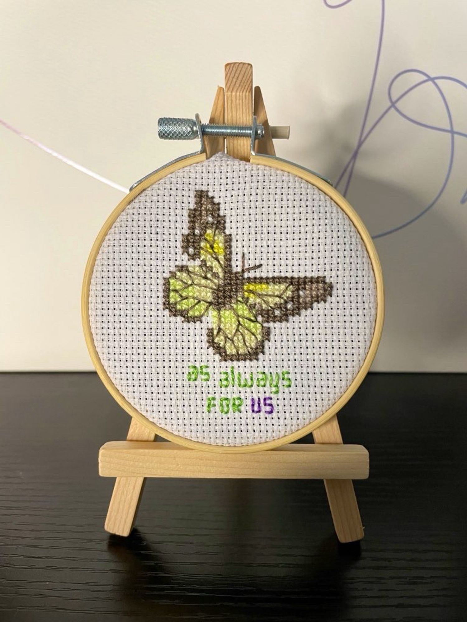 a cross stitch of a butterfly with the text “as always for us”