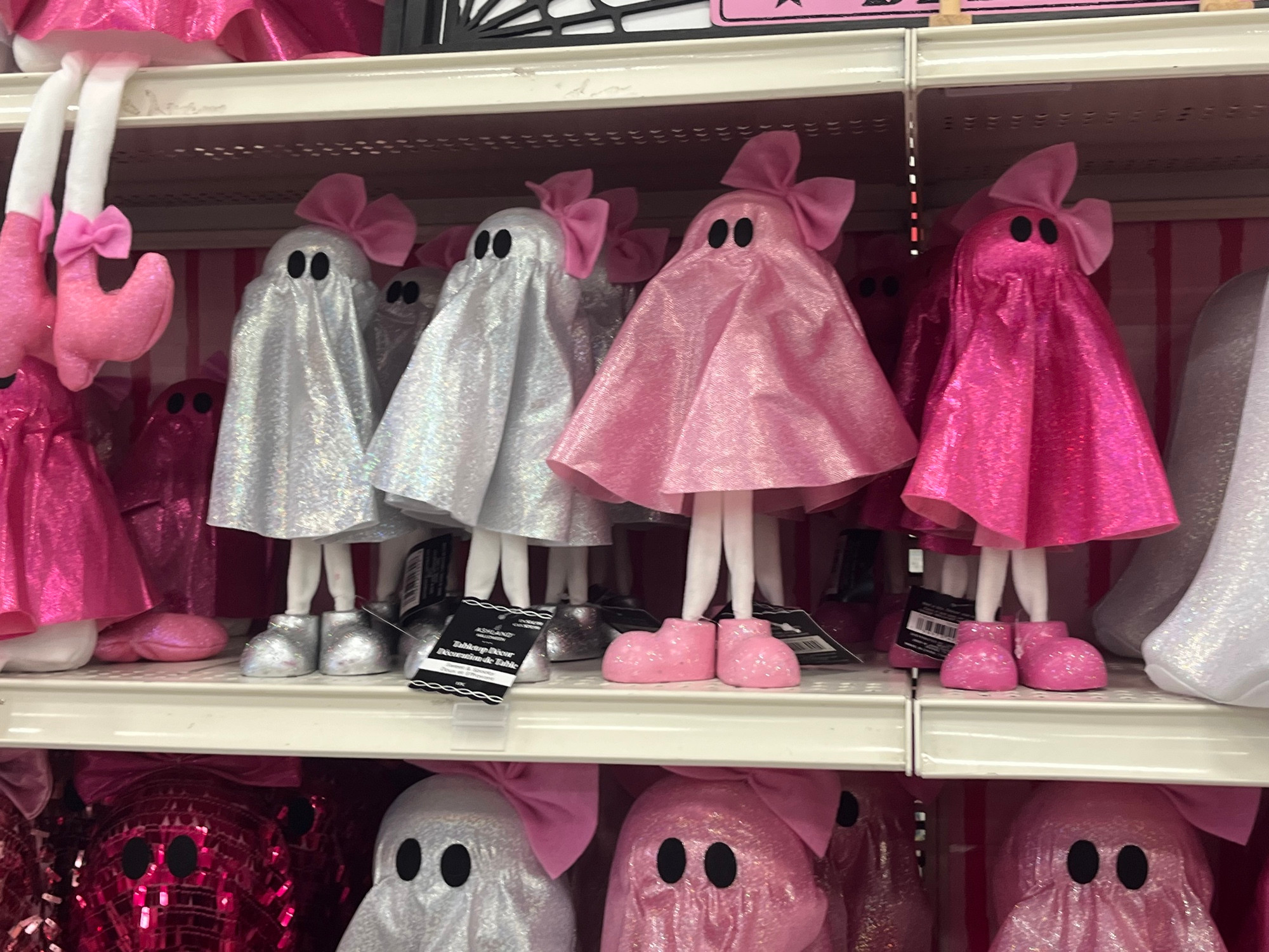 Four photos of pink Halloween decor. Two different shades of pink, in fact. This is ghosts with bows on their heads