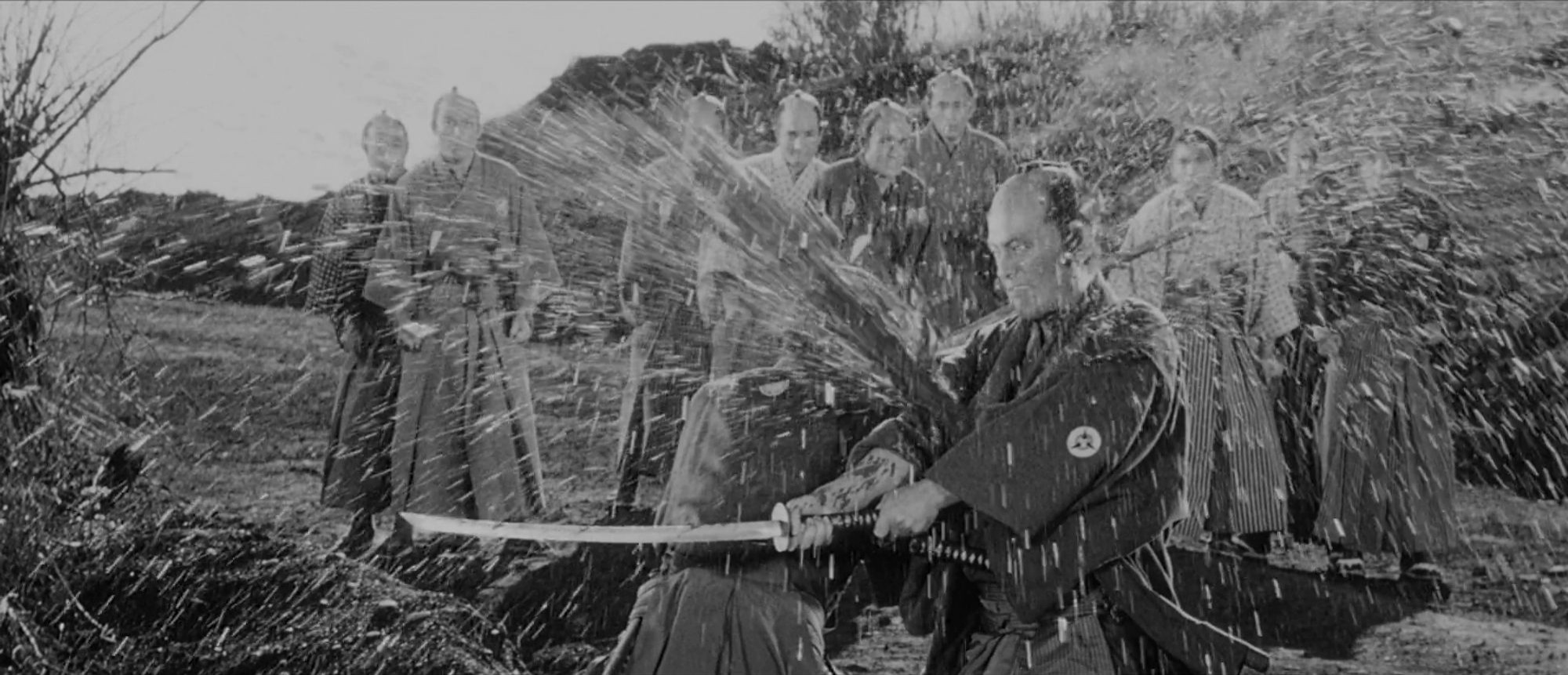 The final scene from Sanjuro, wherein a samurai challenges our protagonist to a duel and gets what's coming to him. Due to an error with the blood pack, it sprayed out like a fire hose, nearly knocking the actor off his feet. A geyser of blood errupts from within the man's clothes as his sword slashes empty air.