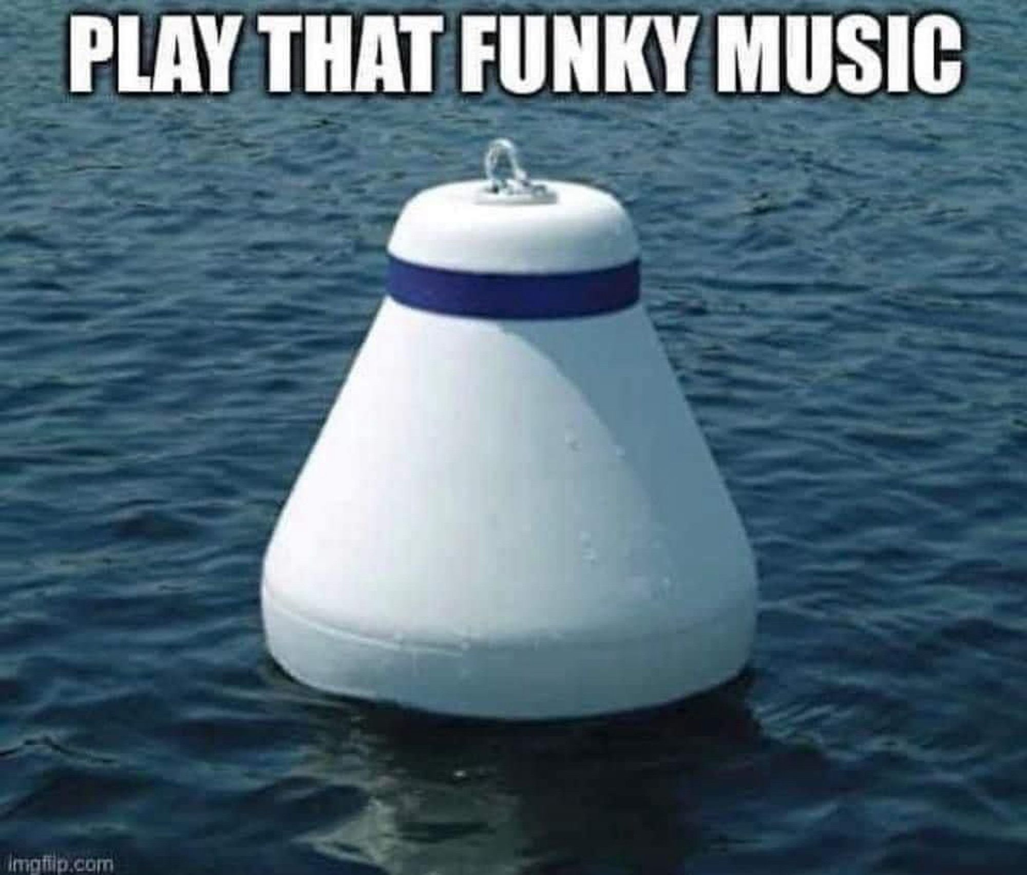 A white buoy floating in the sea, with the words “play that funky music” written at the top of the image.