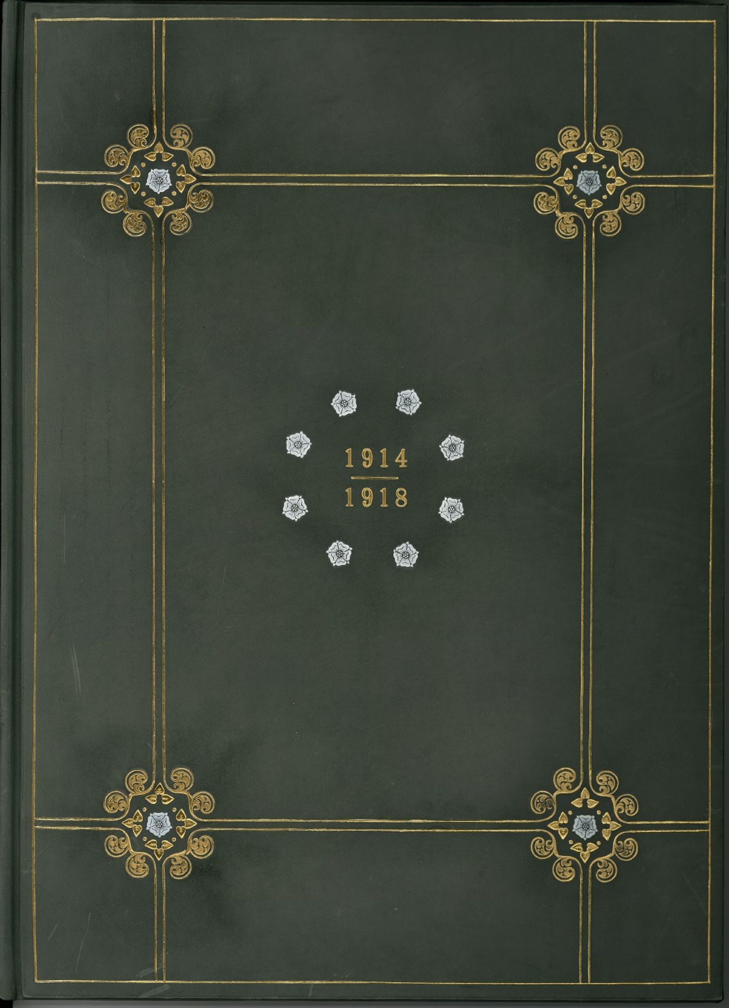 The Supplementary Volume of The Borough of Keighley 1914 - 1918 roll of honour.
This is a green leather bound volume contining the names of some of the fallen of Keighley. It is embellished with gold lines dividing it into 9 rectangles with a large one in the centre. At the four intersections, the lines finish in scrolled designs centred by a small white rose.
In the centre of the large middle panel are the dates 1914 and 1918 and they are surrounded by a circle of eight small white roses.