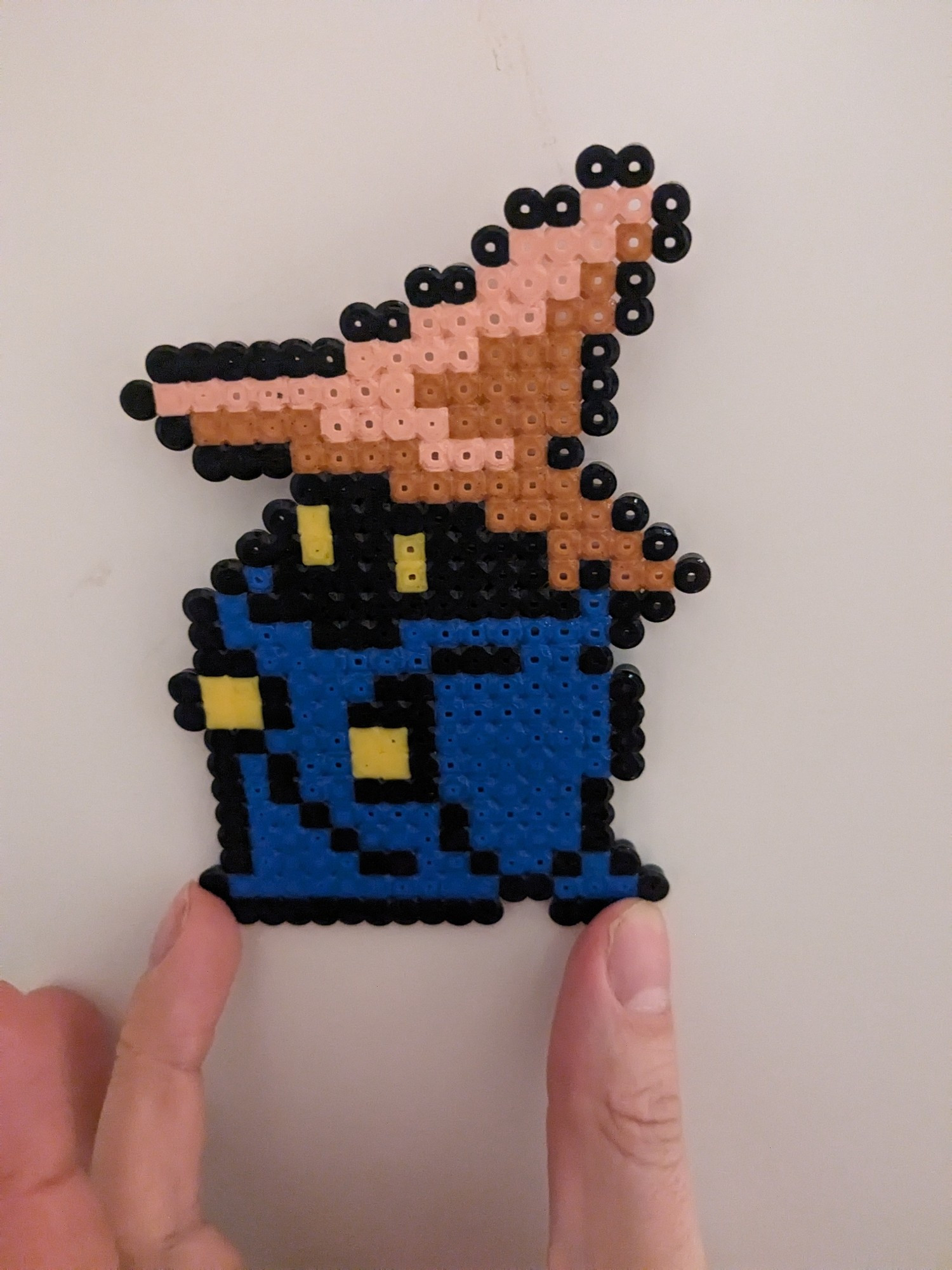 The sprite of Black Mage from the first Final Fantasy recreated with beads.
It's a cool little dude in a big floppy hat and blue robes